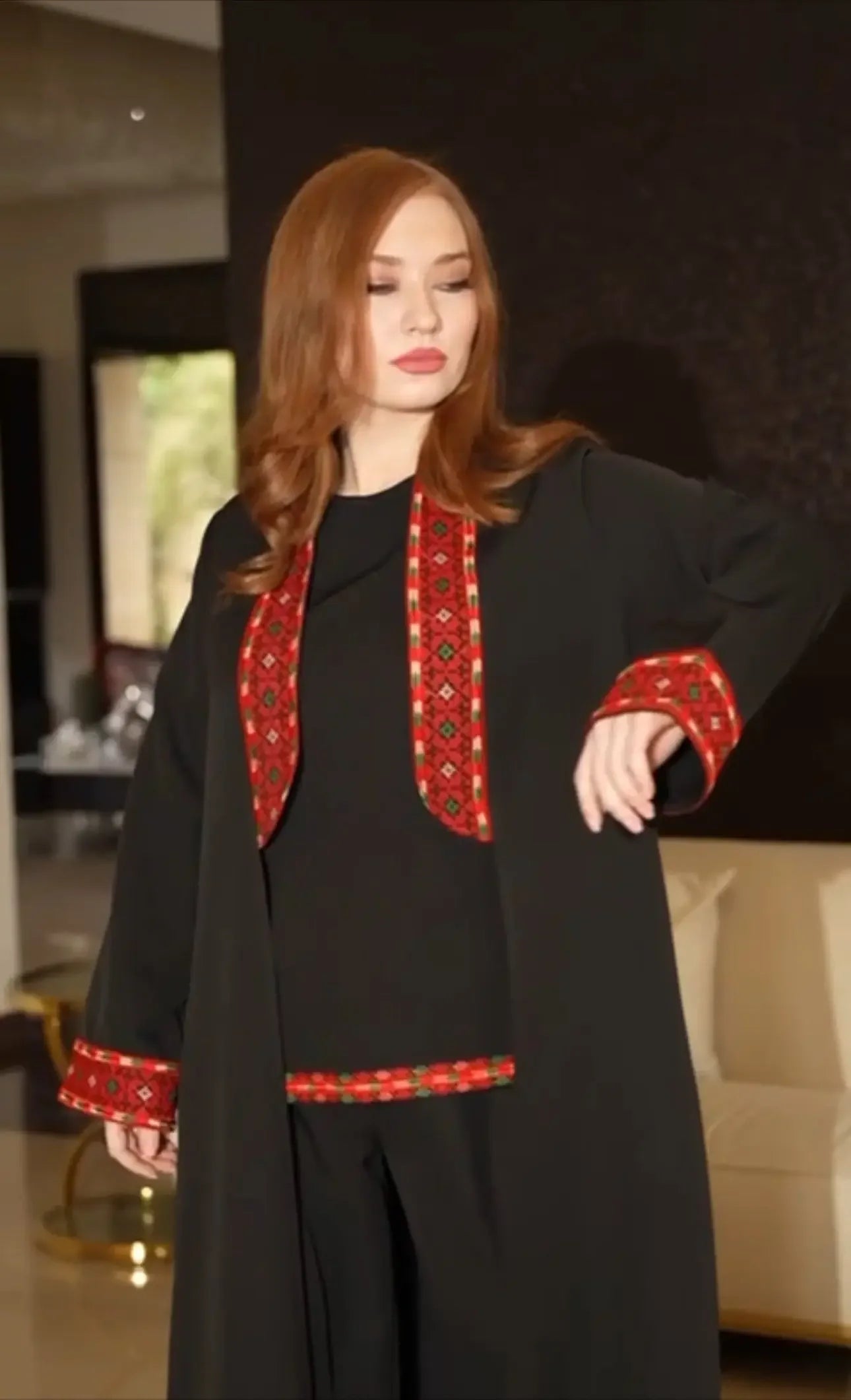 Palestinian Elegance traditional embroidery suit in black with red embroidered details on collar and cuffs