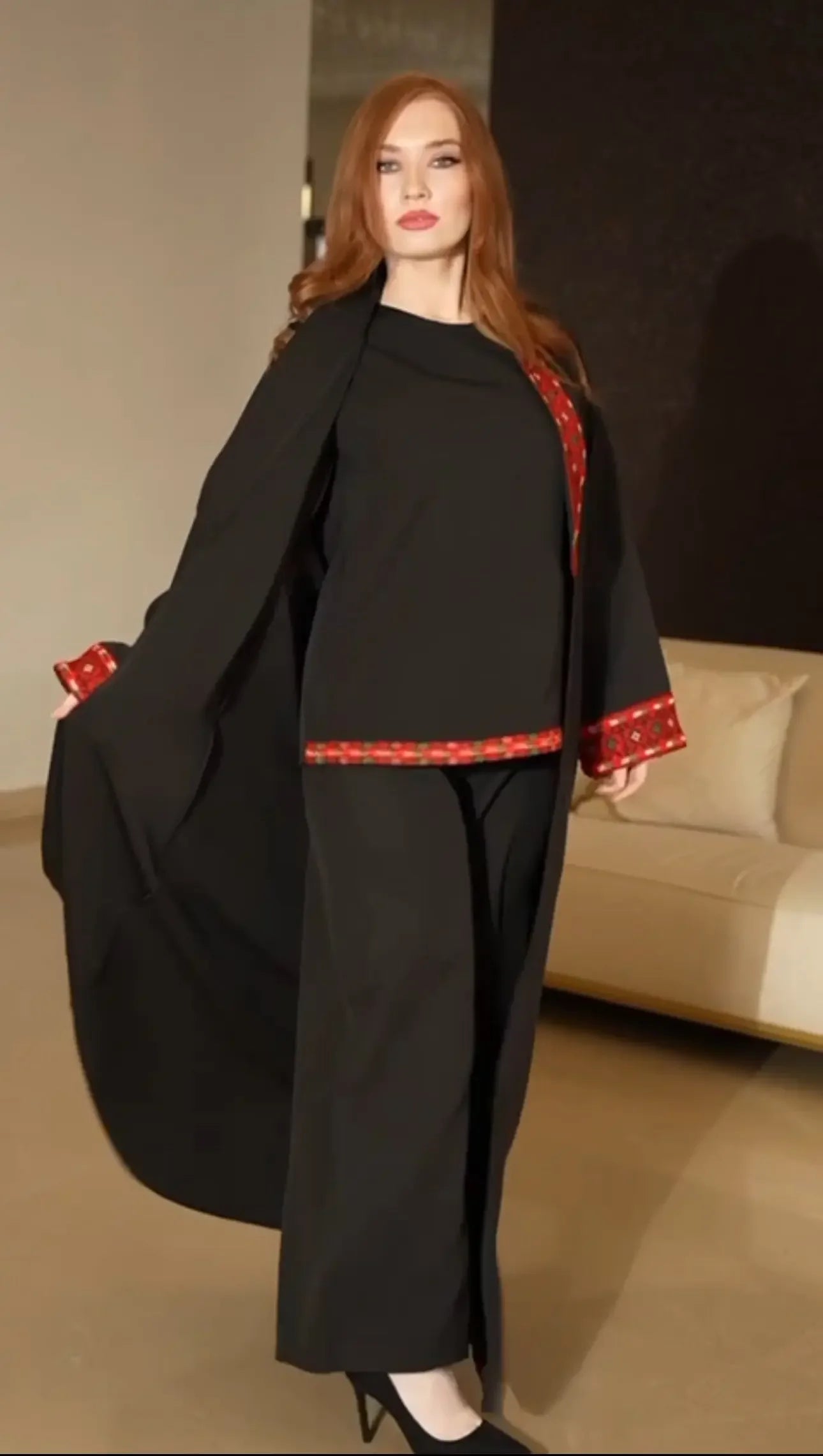 Palestinian Elegance traditional embroidery suit in black with red embroidered accents on sleeves and hem