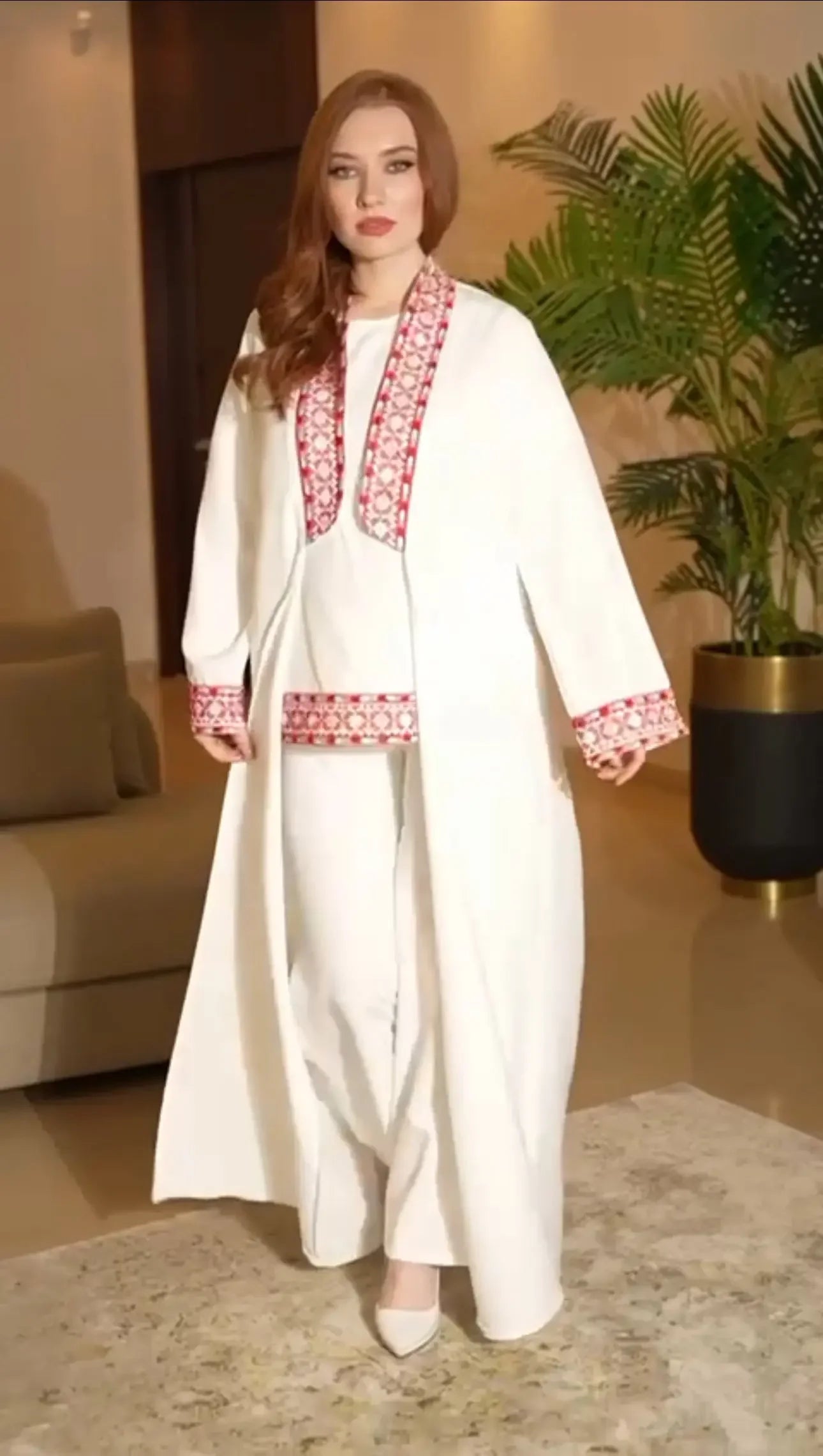 Palestinian Elegance traditional embroidery suit in white with red embroidered details on collar and sleeves