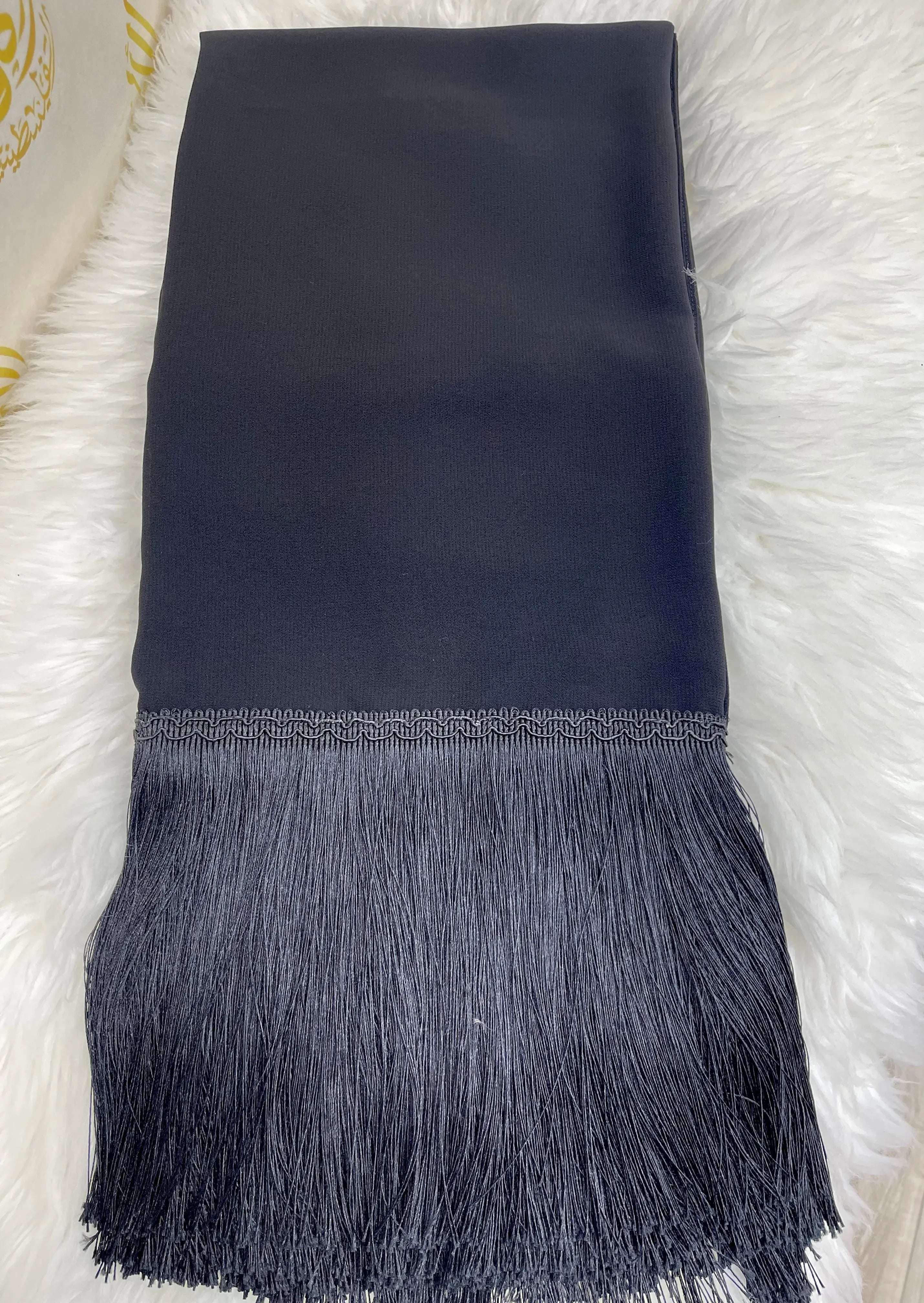 Black hijab with long fringes from Palestinian Elegance featuring traditional khirka shal design