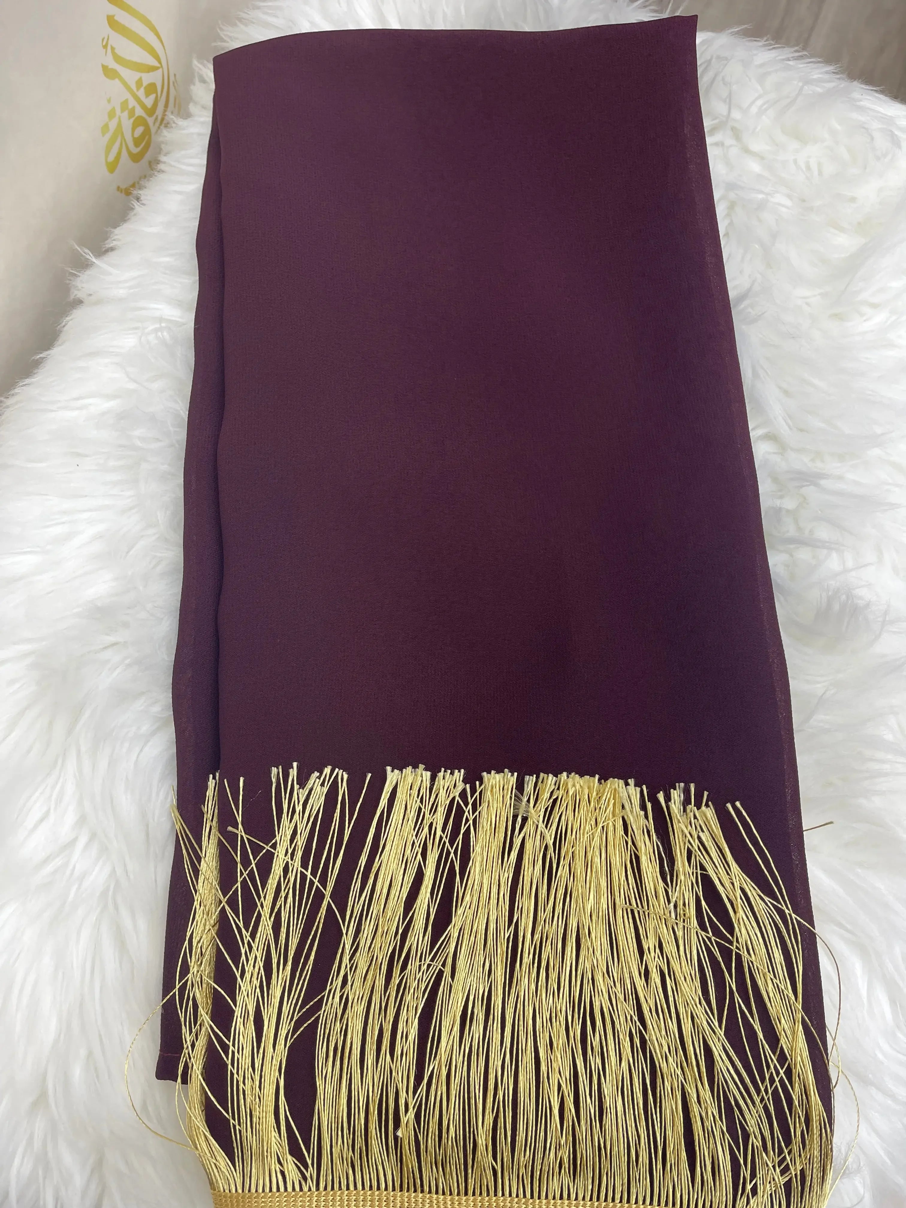 Palestinian Elegance traditional khirka shal in deep purple with gold fringe on white background
