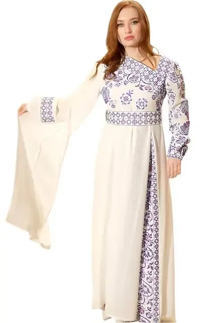 Traditional Palestinian embroidery dress by Palestinian Elegance featuring intricate purple floral embroidery on white fabric