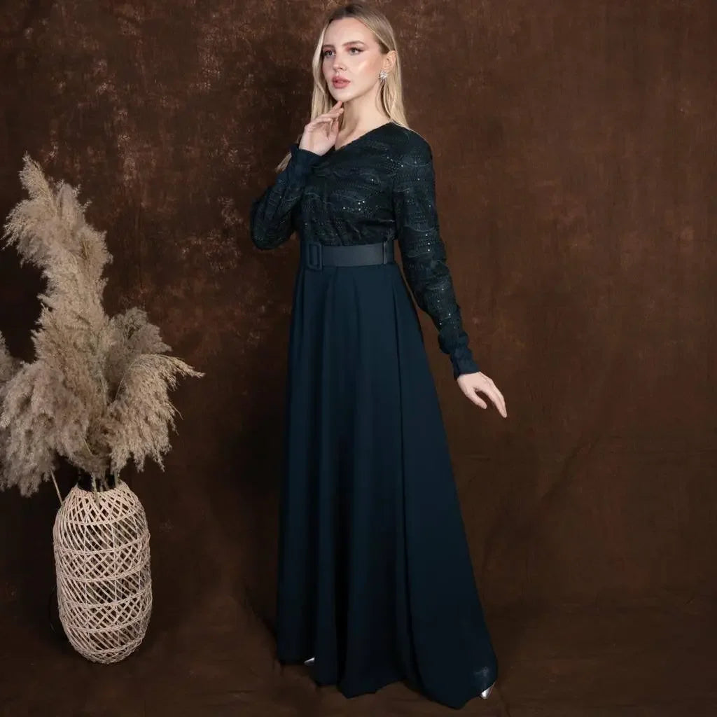 Elegant black tulle dress with long sleeves and belt by Palestinian Elegance on model