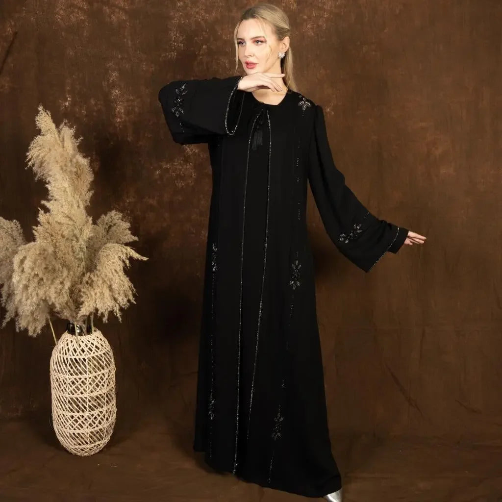 Palestinian Elegance black abaya with subtle embroidery on sleeves and front side