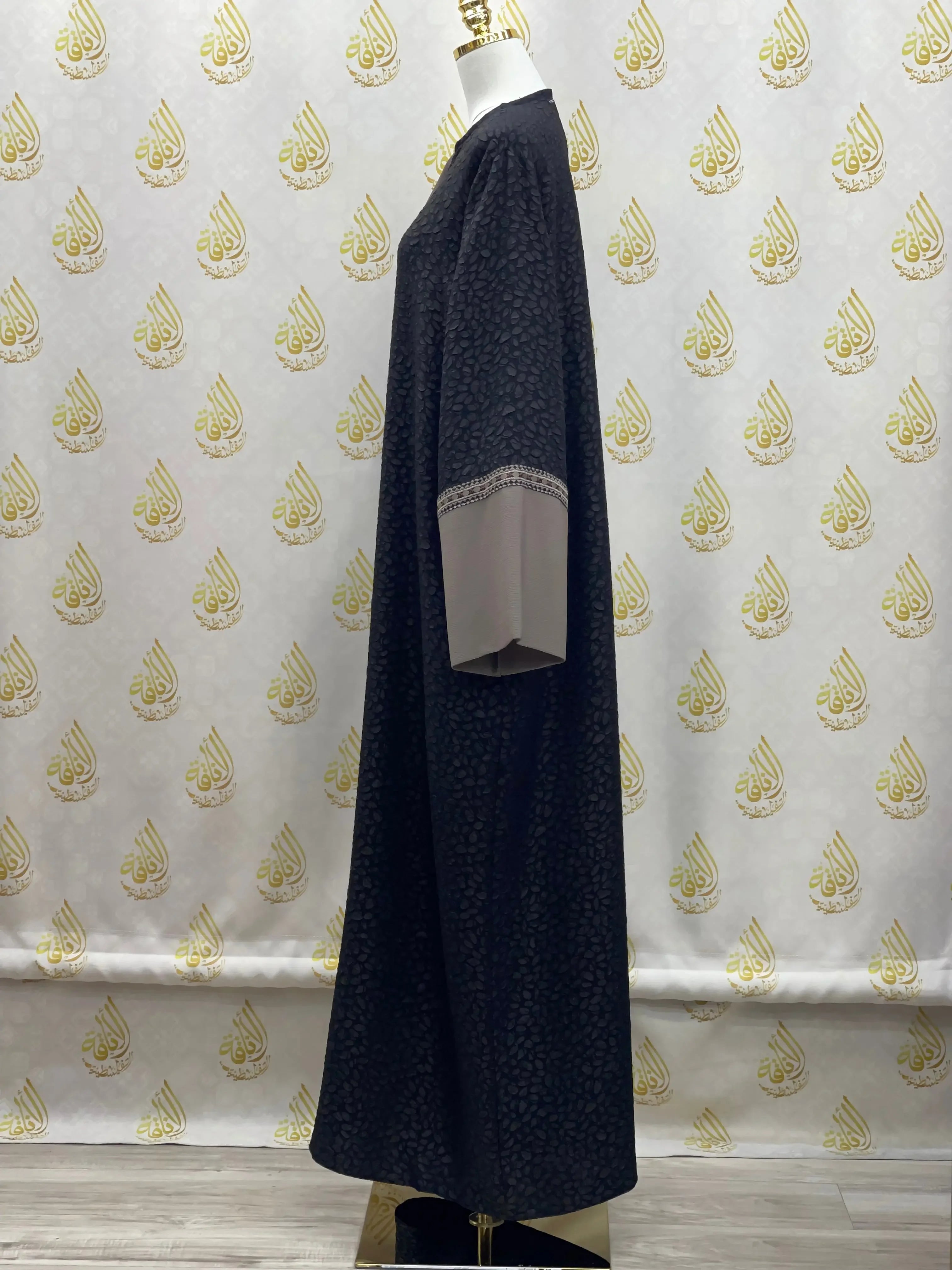 Chic abaya for women by Palestinian Elegance in black with beige cuff details and elegant embroidery