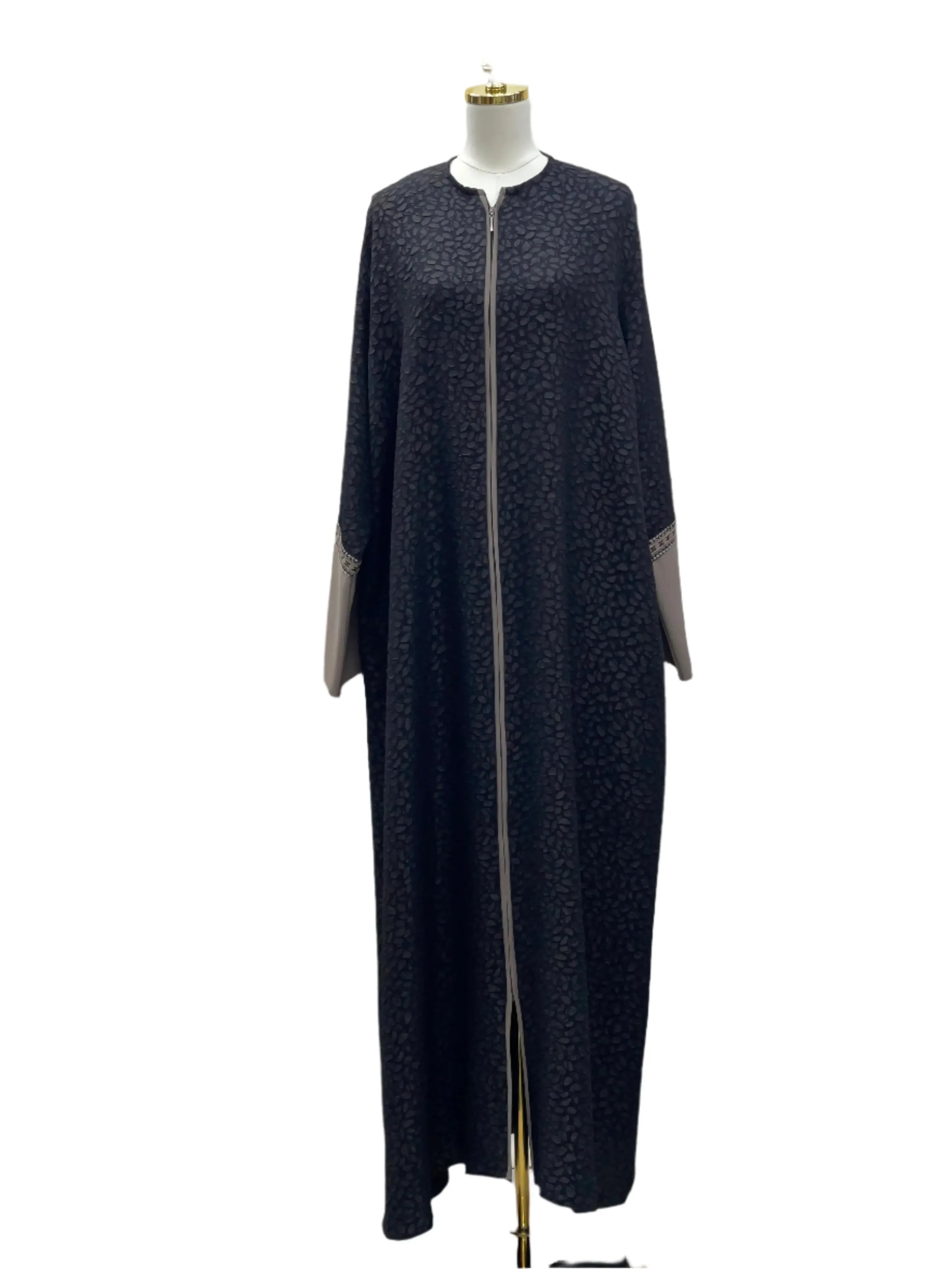 Chic abaya for women in black with subtle patterns and beige sleeve accents by Palestinian Elegance