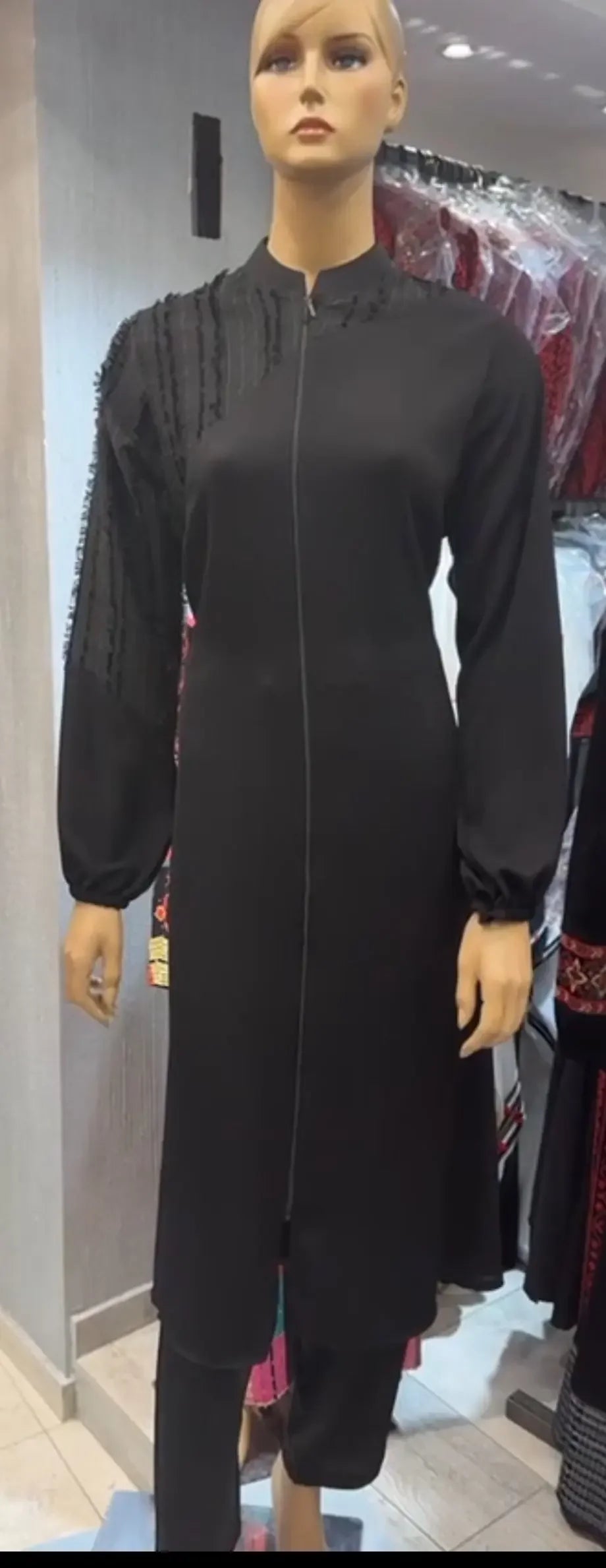 Palestinian Elegance black elegant abaya set with long sleeves and detailed embroidery on one shoulder