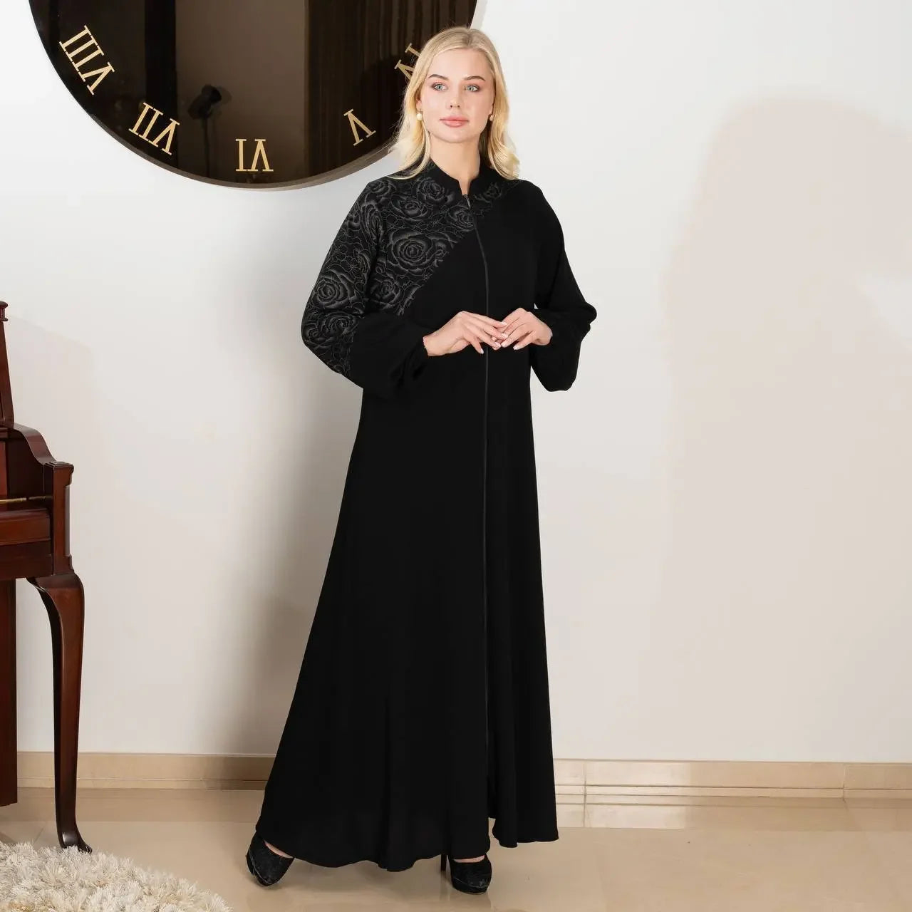 Elegant abaya set from Palestinian Elegance featuring black fabric with floral textured details on sleeve and upper chest