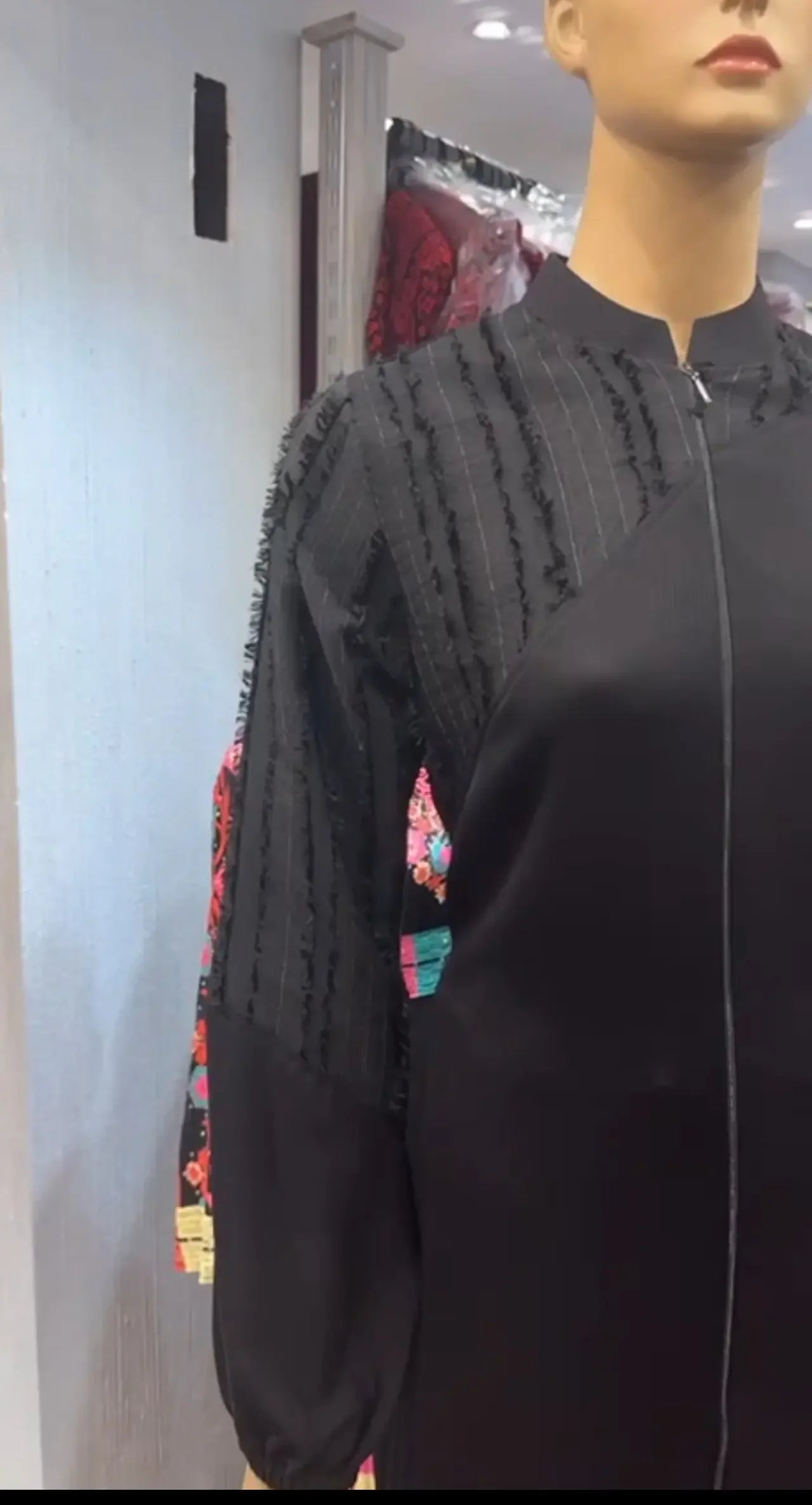 Palestinian Elegance casual elegant abaya set in black with textured shoulder details on mannequin