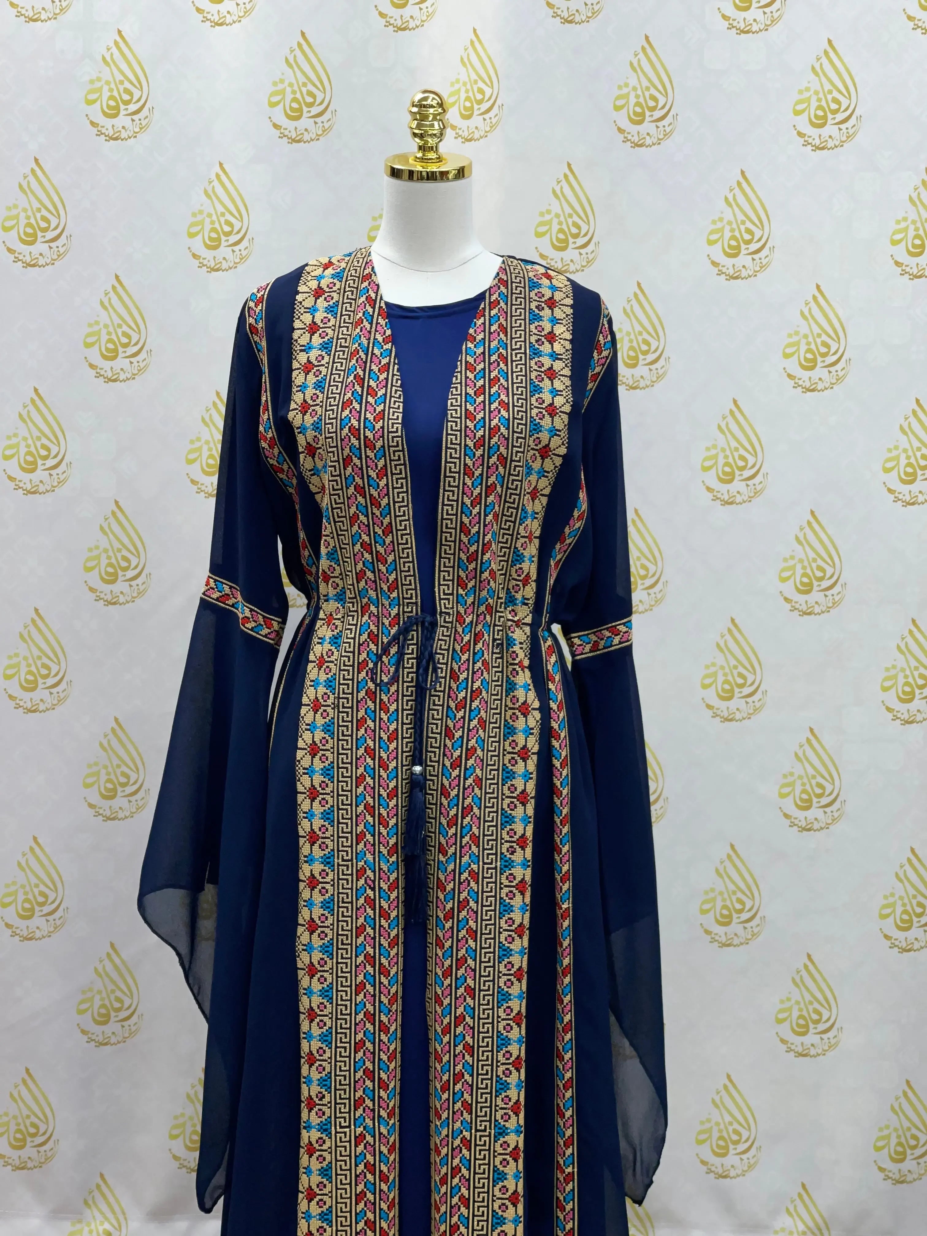 Palestinian Elegance embroidered chiffon set featuring traditional vibrant embroidery on navy fabric