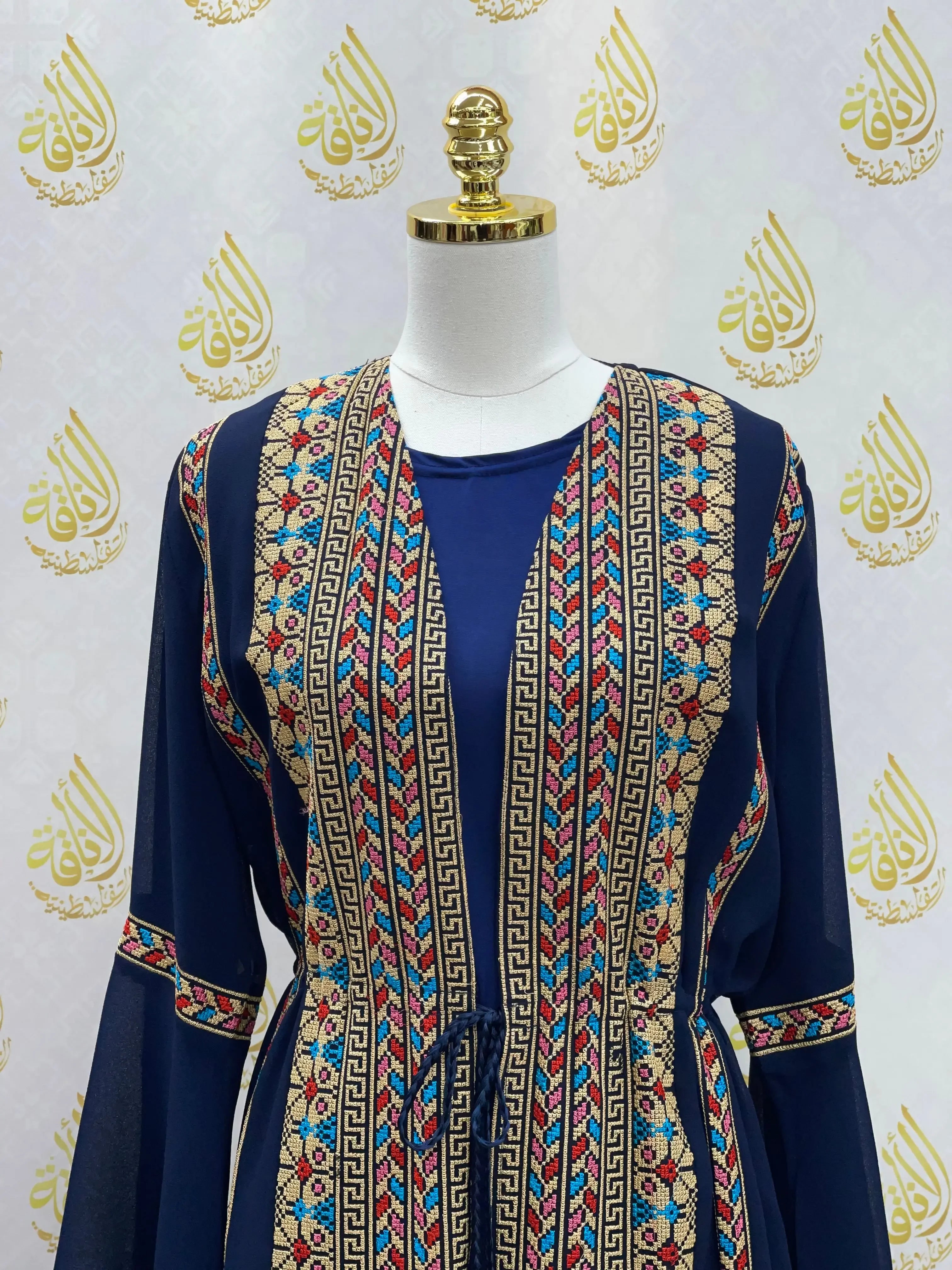 Palestinian Elegance embroidered chiffon set featuring intricate multicolor embroidery on navy fabric with long sleeves