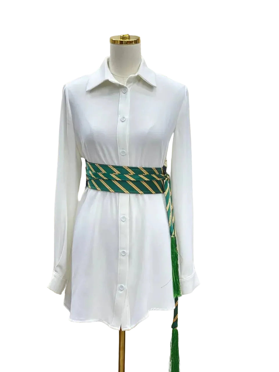 White shirt dress styled with a green and gold embroidered kashmir belt featuring tassels