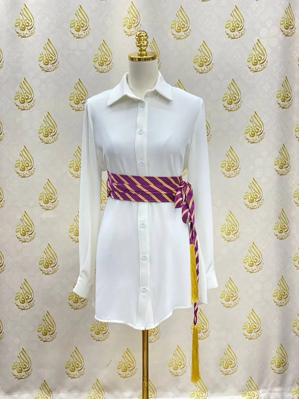 White shirt dress styled with purple and gold embroidered kashmir belt tied around the waist