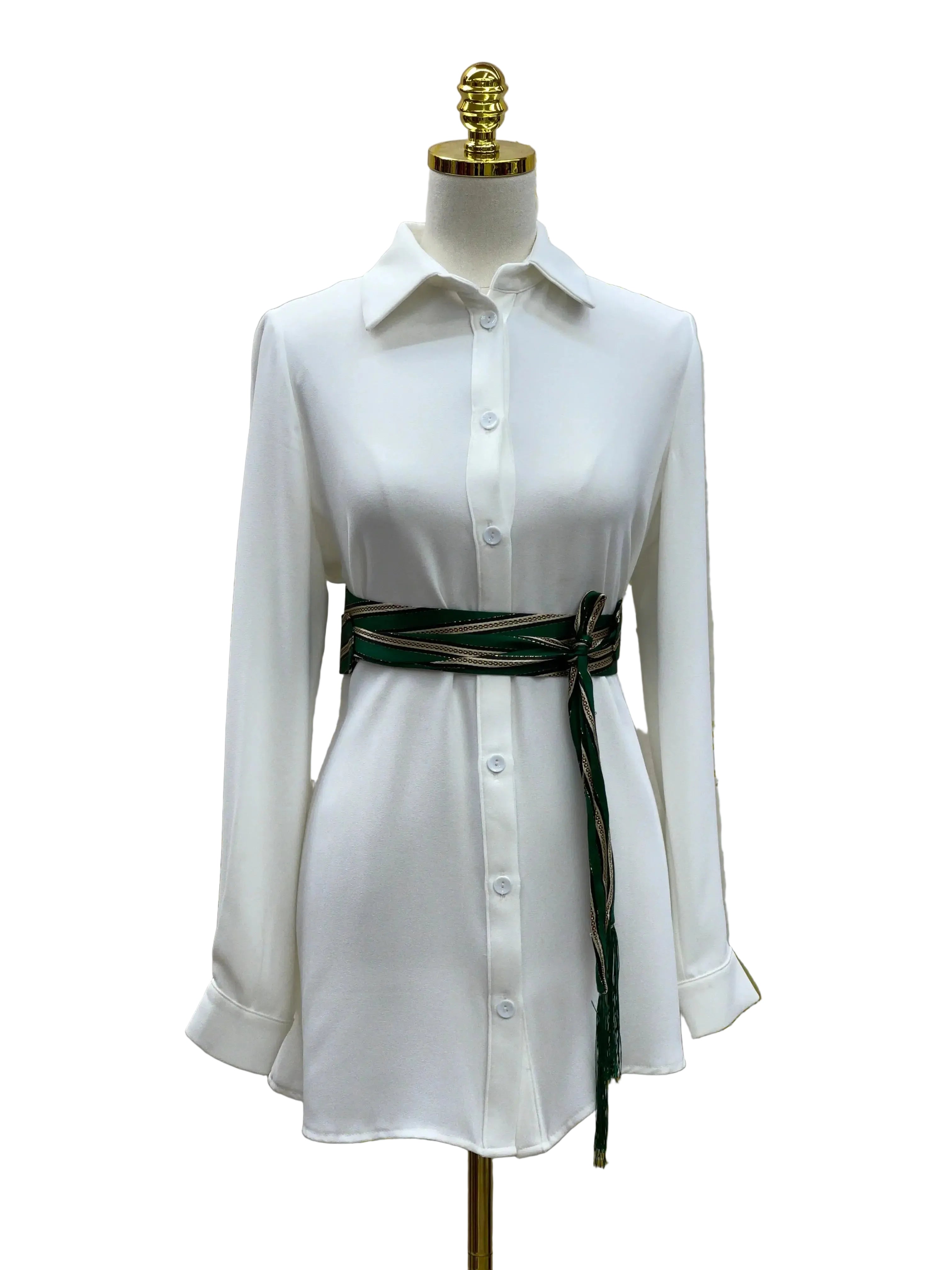 White long sleeve dress styled with Palestinian Elegance embroidered saya belt tied at the waist