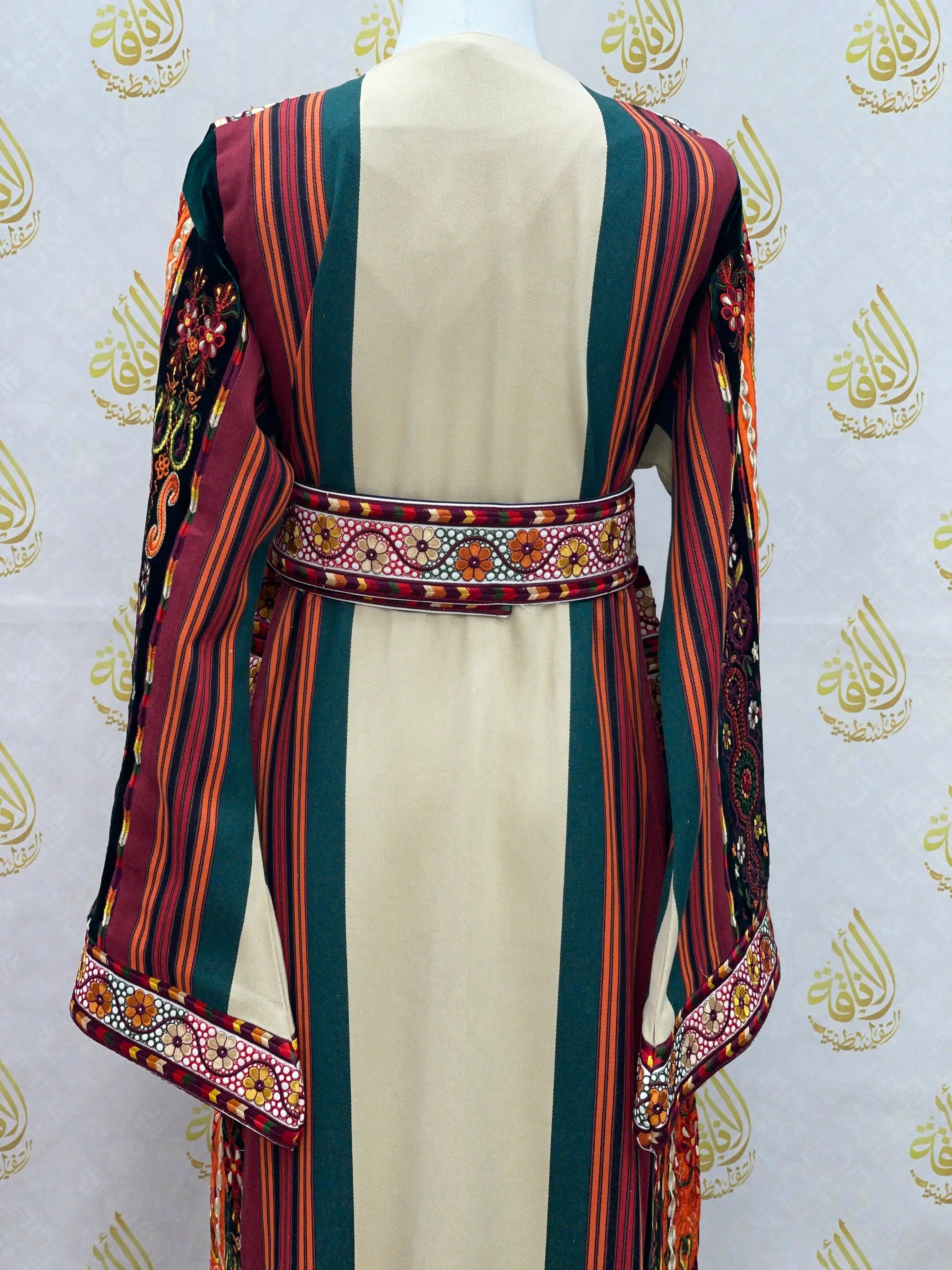 Back view of Palestinian embroidered thoub dress with striped pattern and detailed floral embroidery by Palestinian Elegance