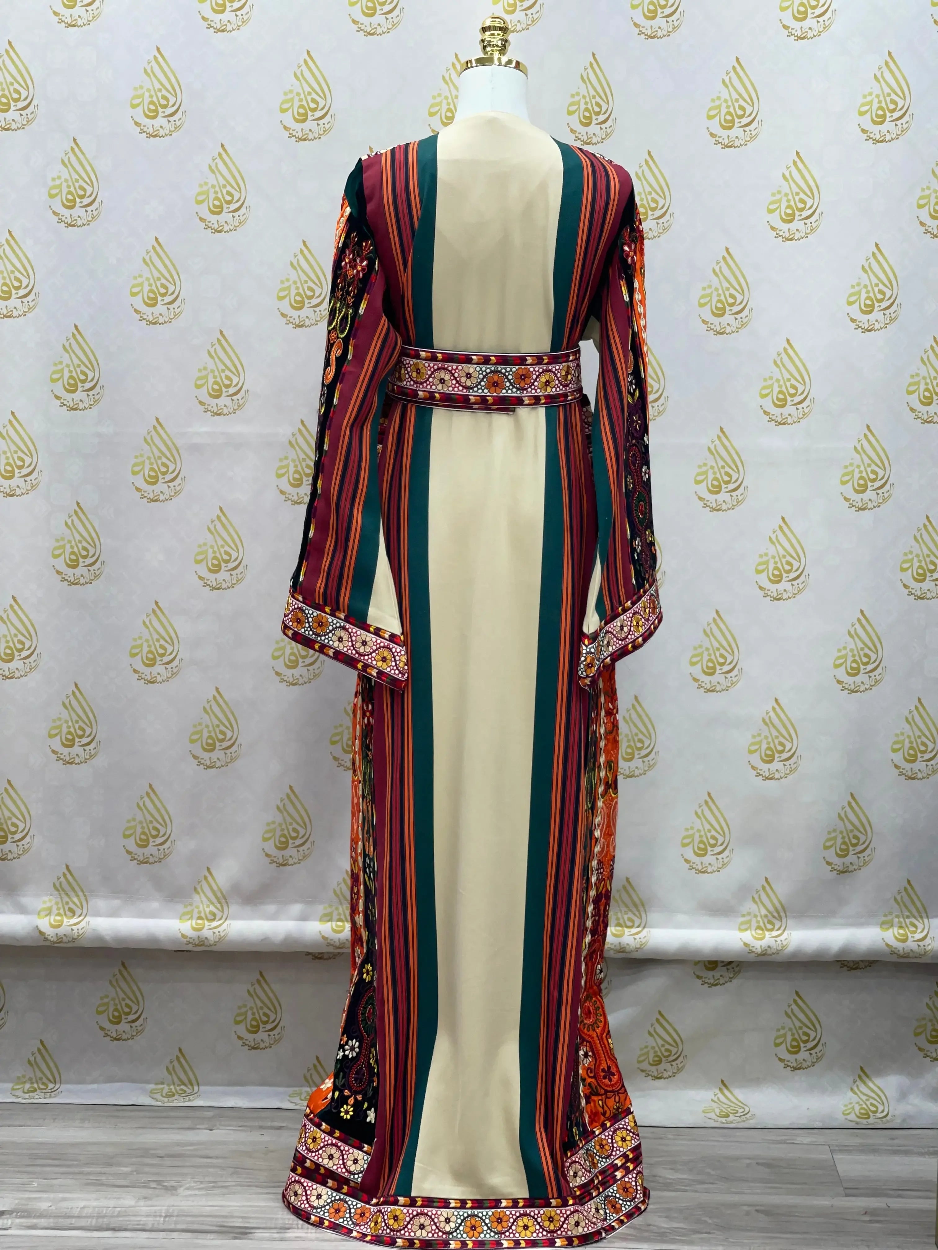 Back view of Palestinian embroidered thoub dress with colorful stripes and traditional embroidery by Palestinian Elegance