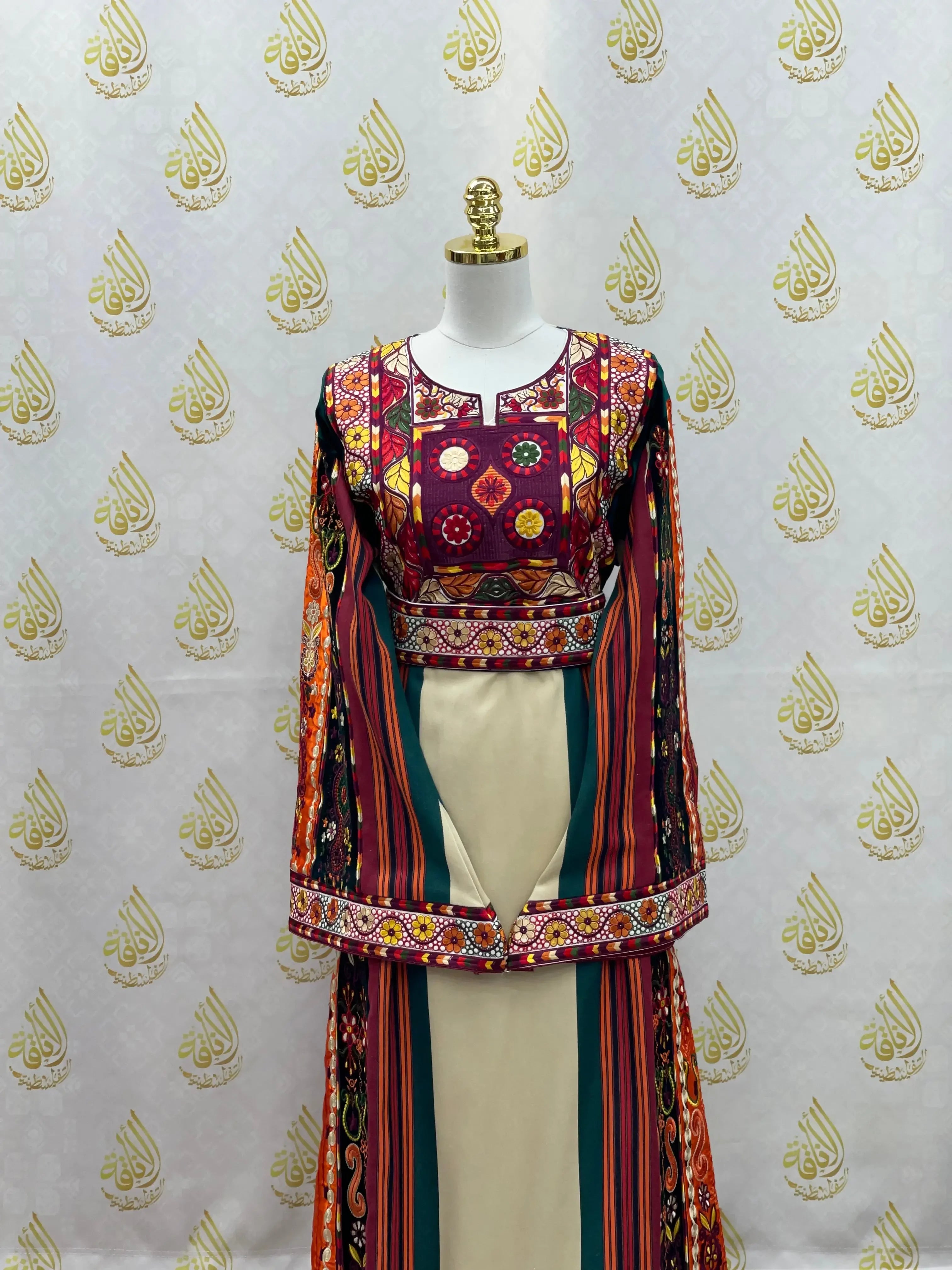 Palestinian embroidered thoub dress with colorful traditional patterns and intricate stitching on mannequin