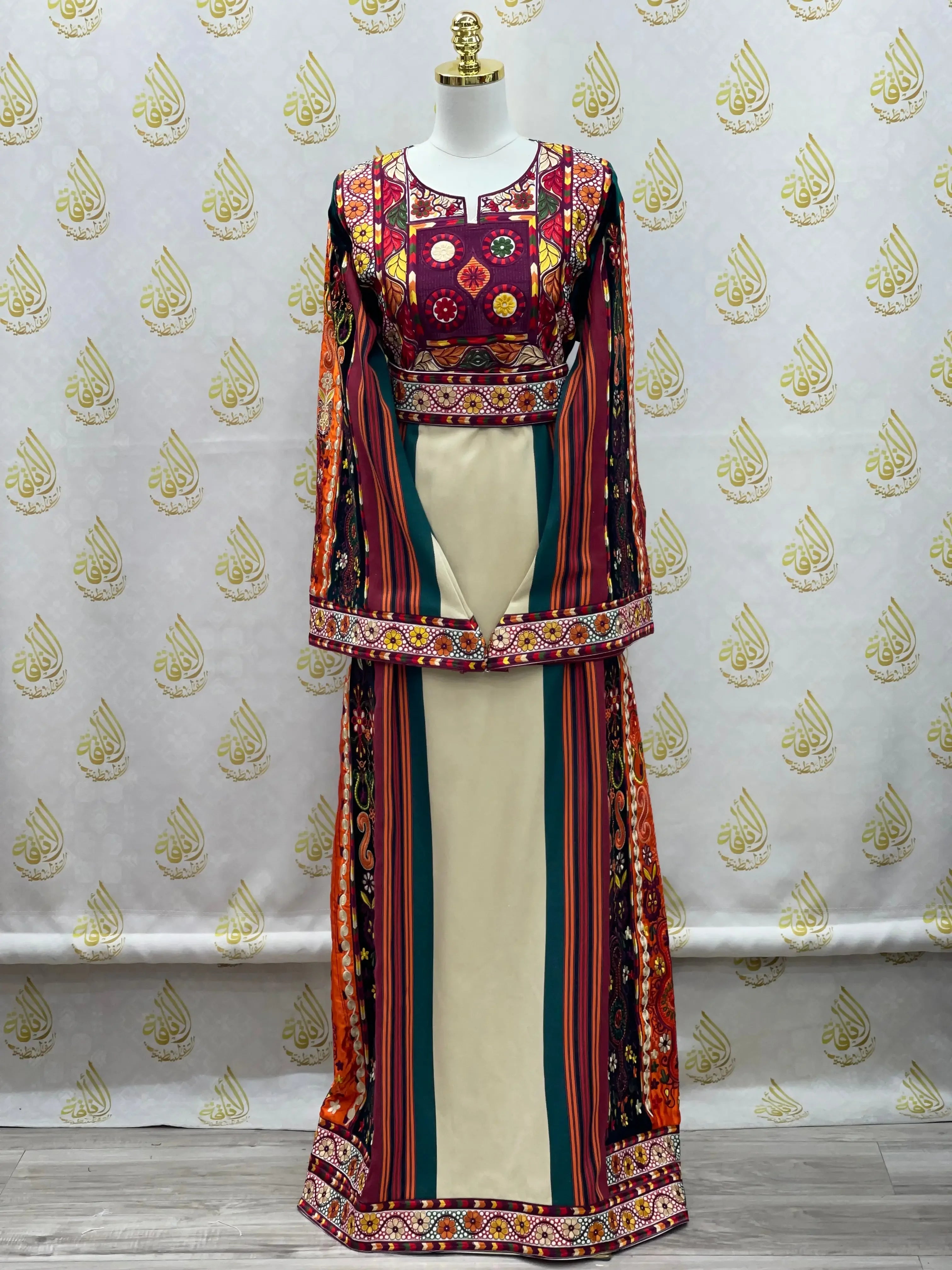 Palestinian embroidered thoub dress with colorful traditional embroidery and striped pattern on mannequin