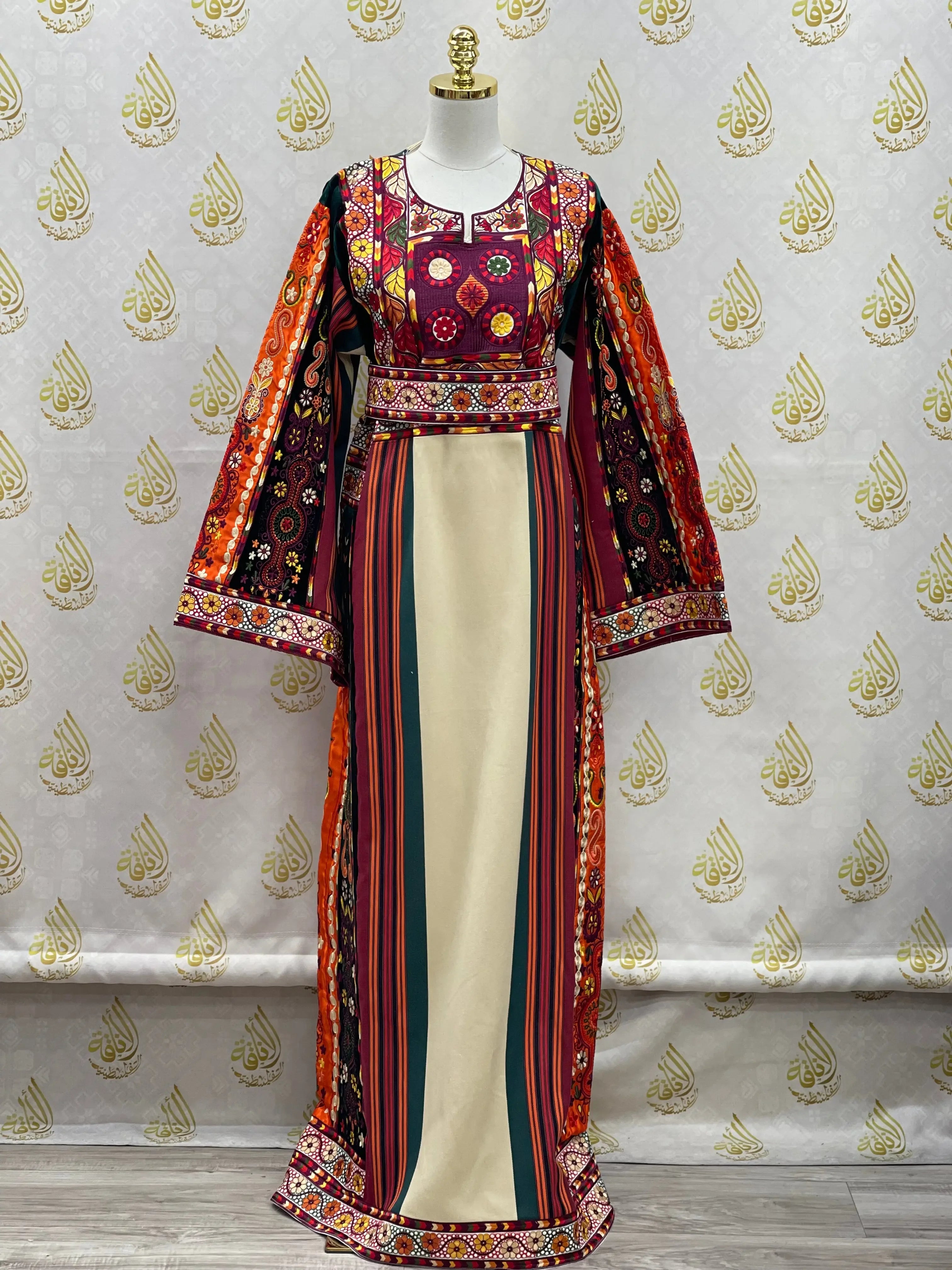 Palestinian embroidered thoub dress by Palestinian Elegance with vibrant traditional embroidery and striped pattern
