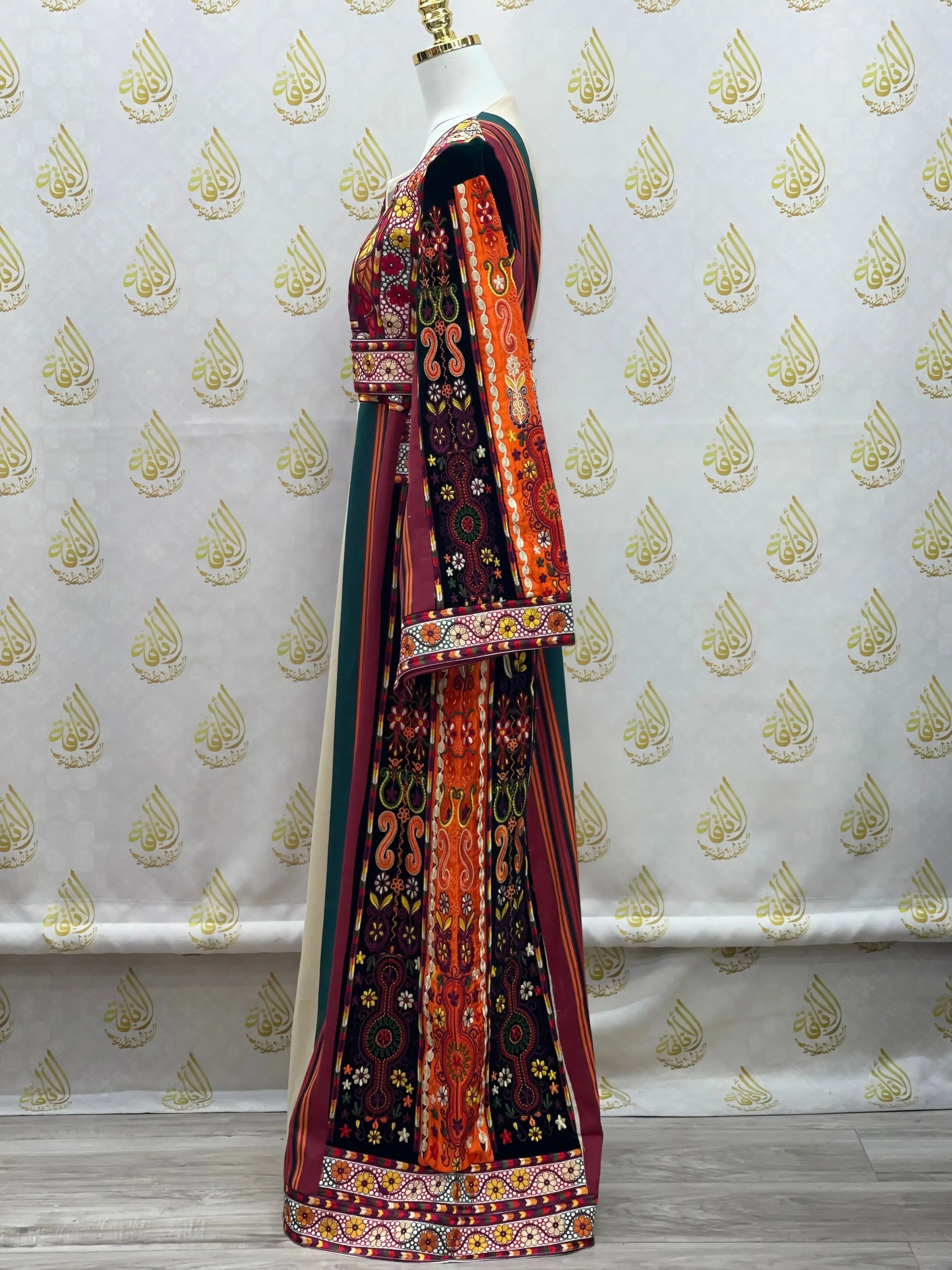 Side view of a colorful Palestinian embroidered thoub dress with intricate traditional patterns