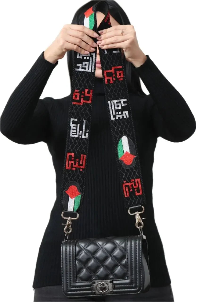 Palestinian purse strap replacement with traditional embroidery and flag colors attached to black quilted handbag