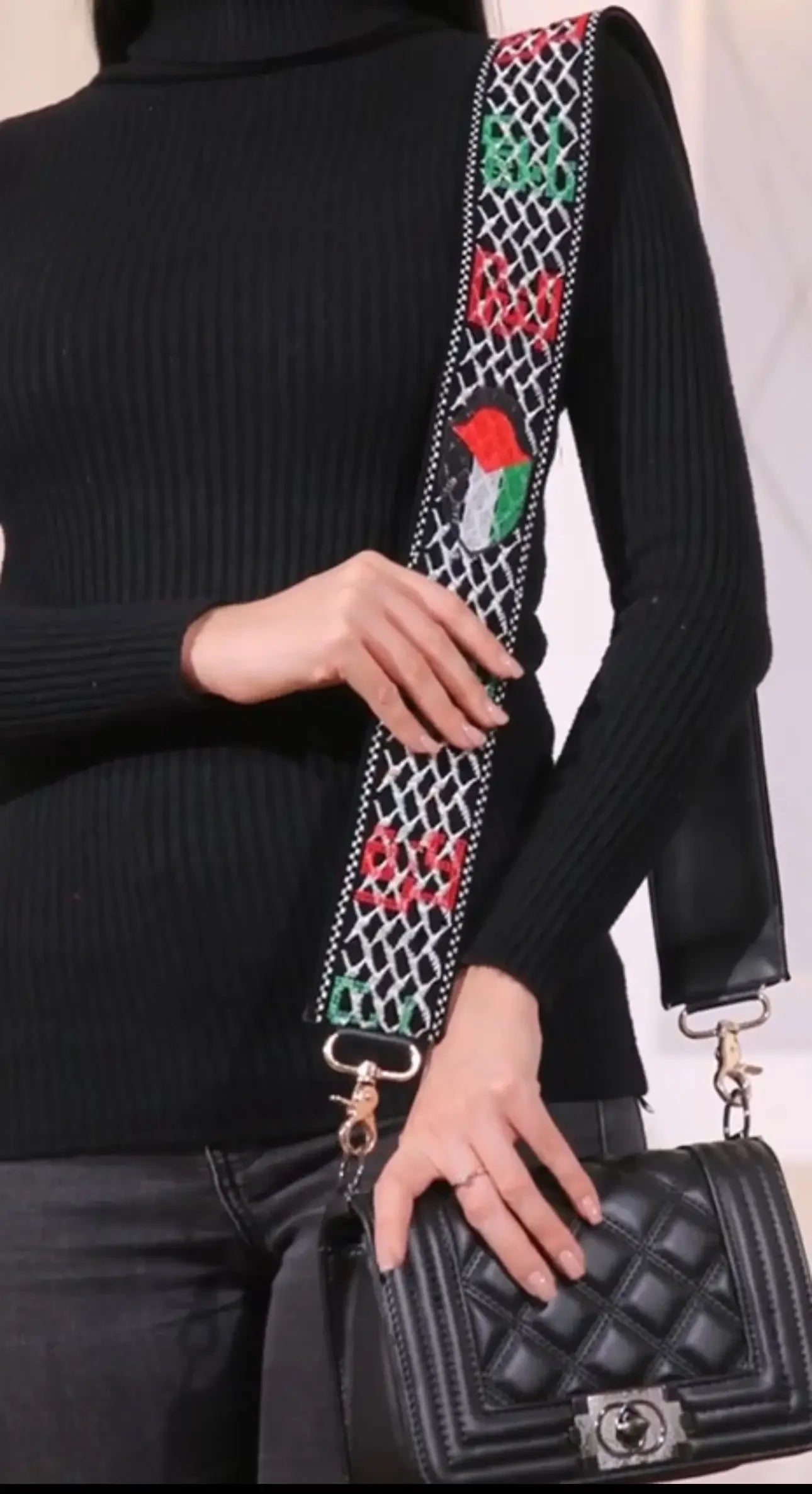 Palestinian purse strap replacement with embroidered geometric and floral patterns by Palestinian Elegance on black quilted purse