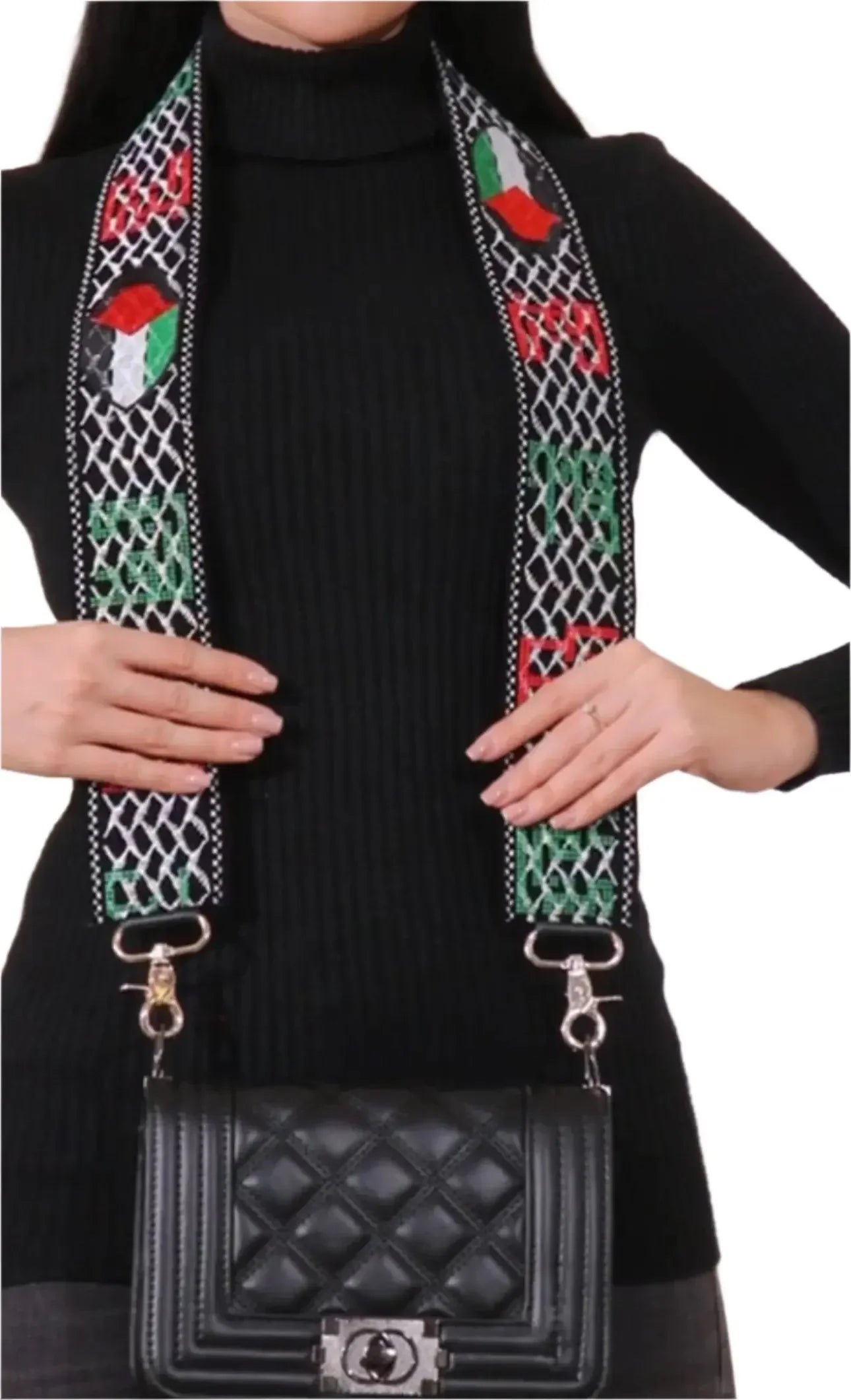 Palestinian purse strap replacement with traditional embroidery attached to black quilted handbag