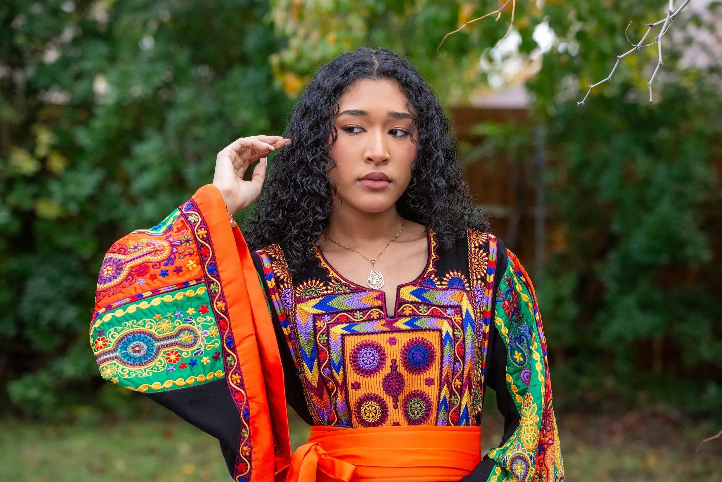 Palestinian Elegance vibrant traditional embroidered dress with colorful geometric patterns