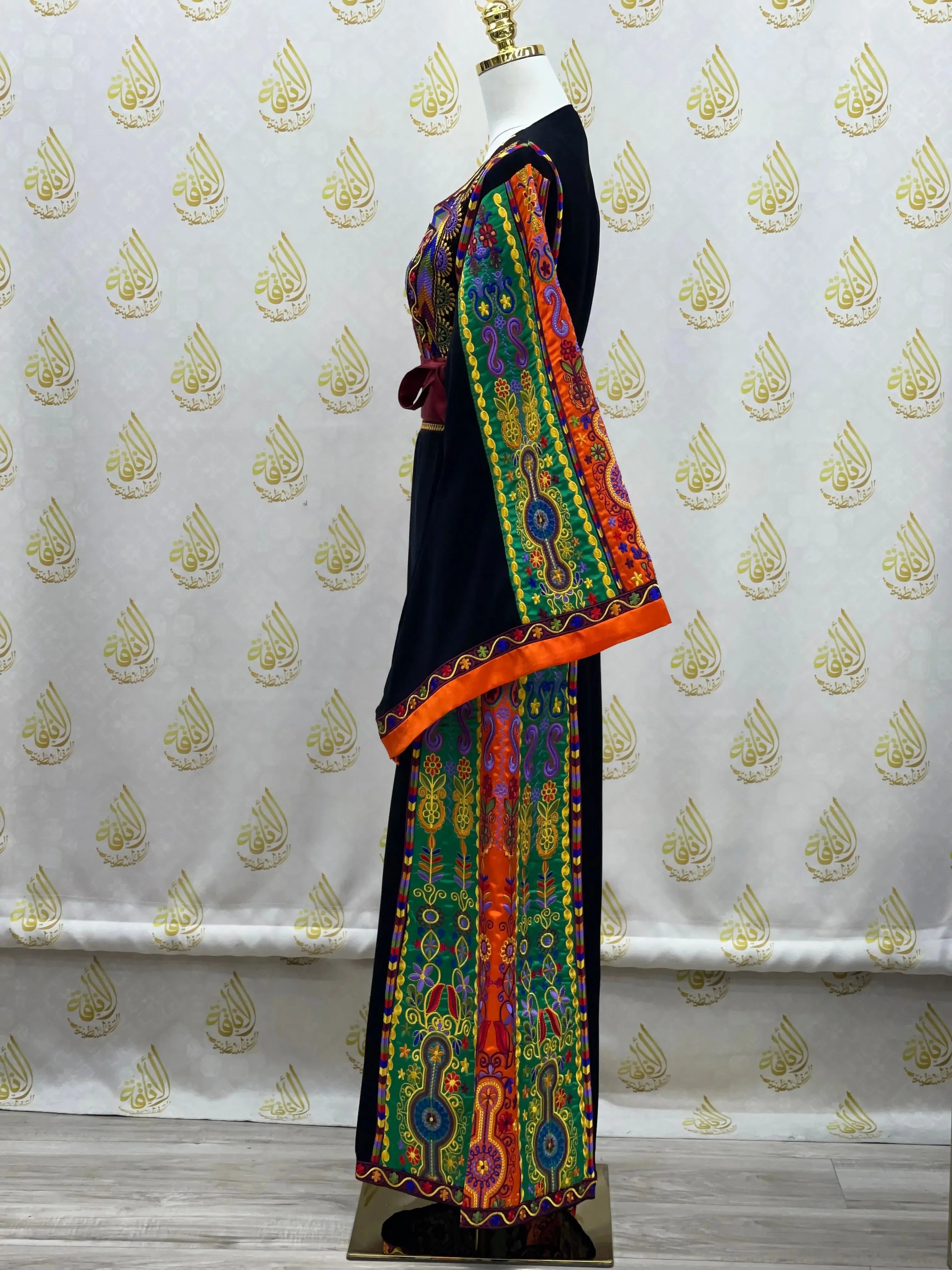 Palestinian Elegance traditional embroidered dress with colorful geometric patterns and orange trim