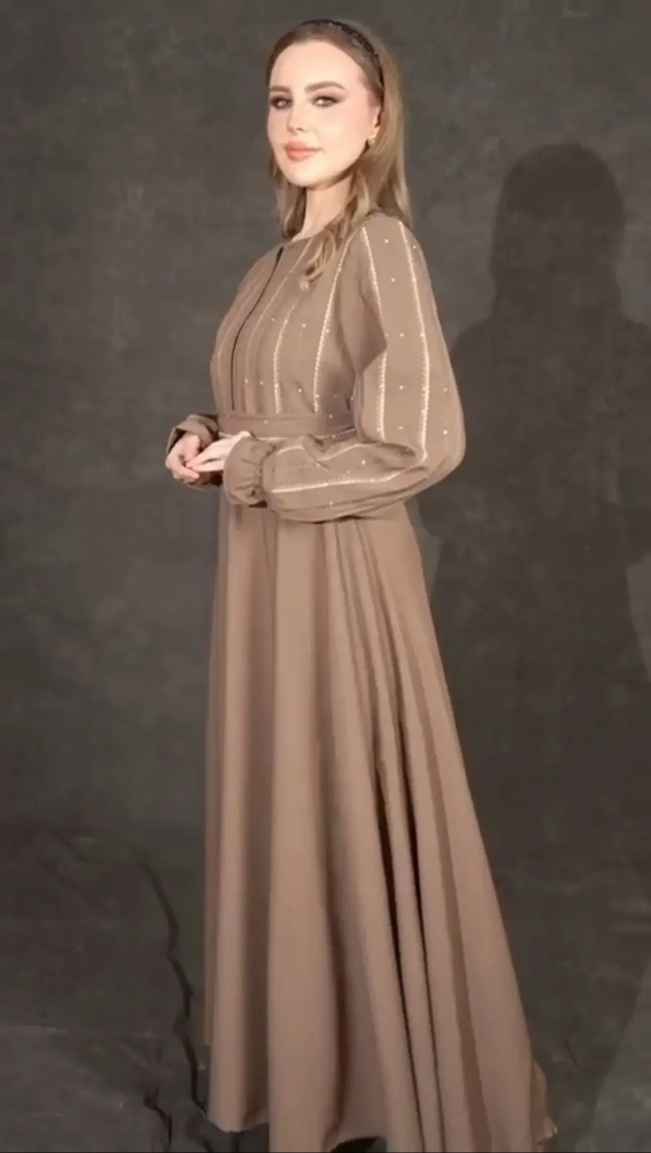 Palestinian Elegance versatile abaya dress in brown with patterned sleeves and flowing skirt