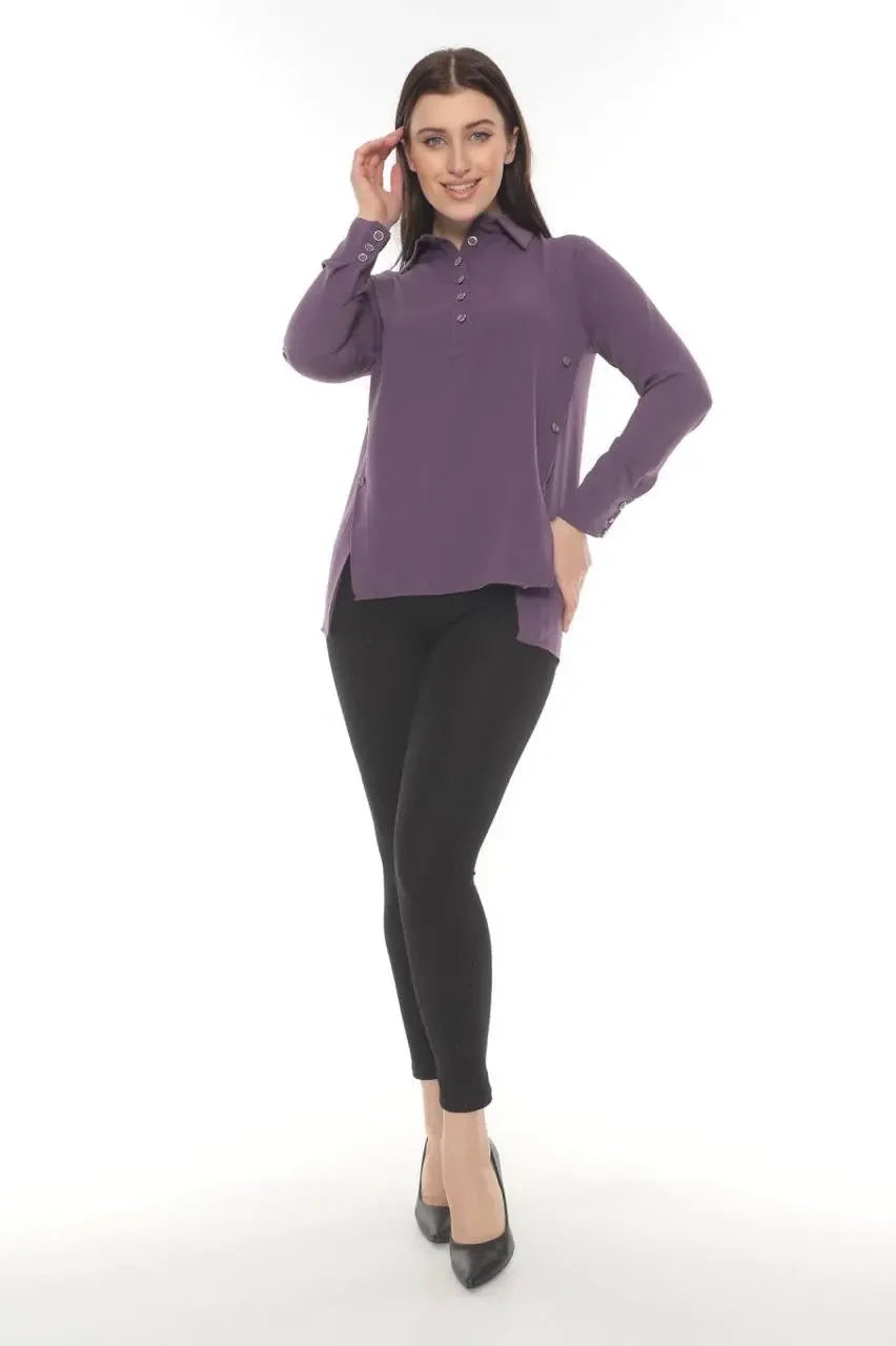Woman wearing a purple versatile chic blouse with long sleeves and black pants