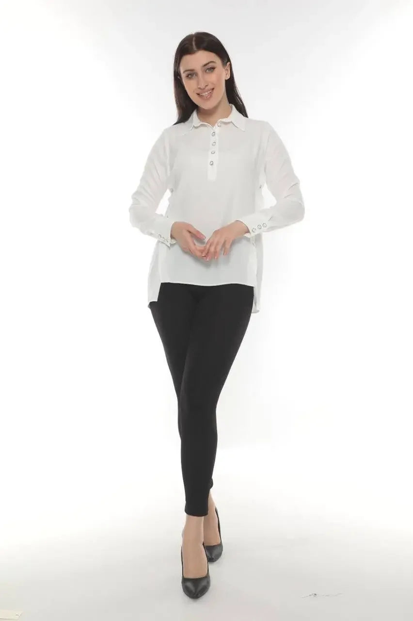Palestinian Elegance versatile chic blouse in white with long sleeves and button details paired with black pants
