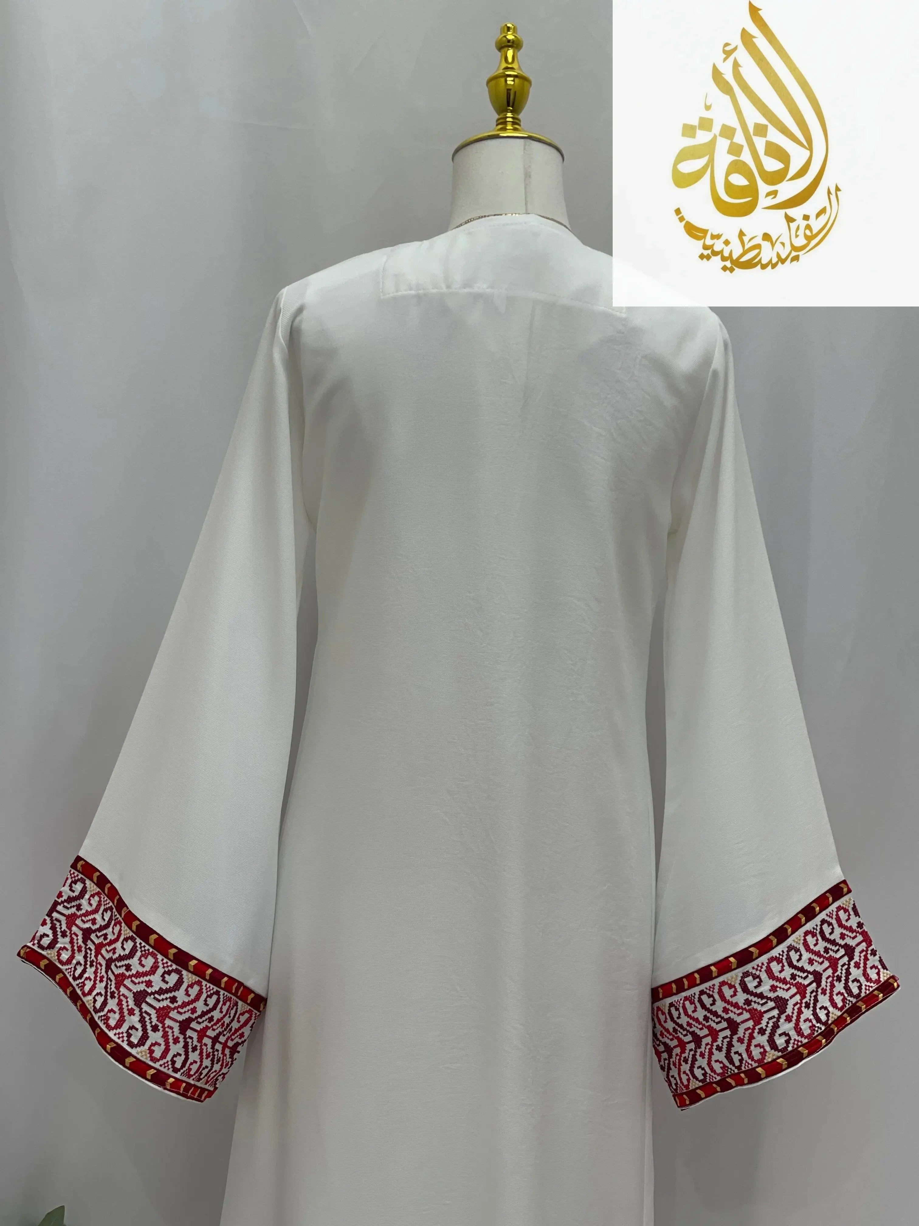 3-piece Ahlam modest dress outfitembroidered with red and maroon traditional patterns on white fabric
