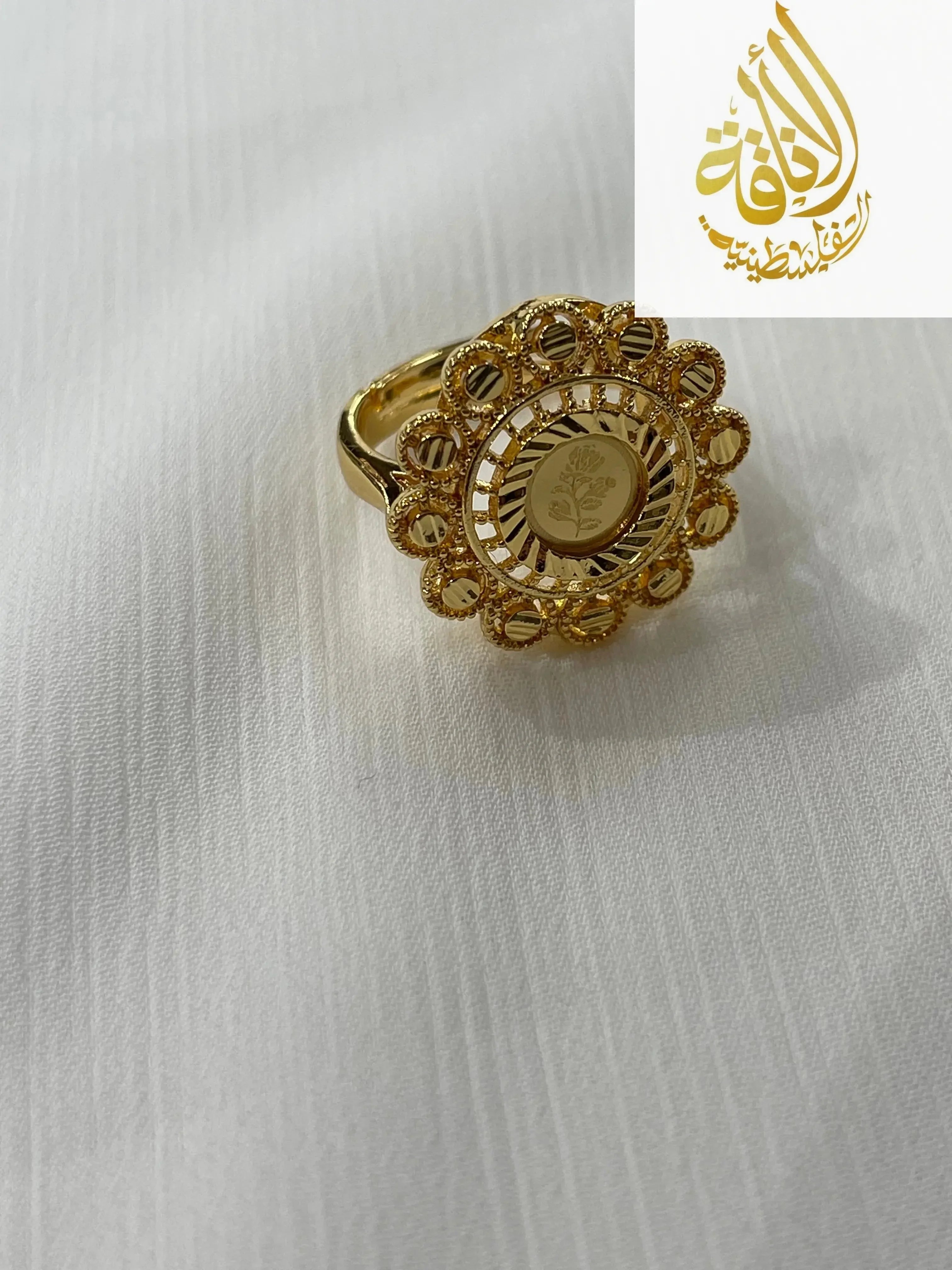 Gold ring with intricate floral design from Palestinian Elegance gold jewelry set for women