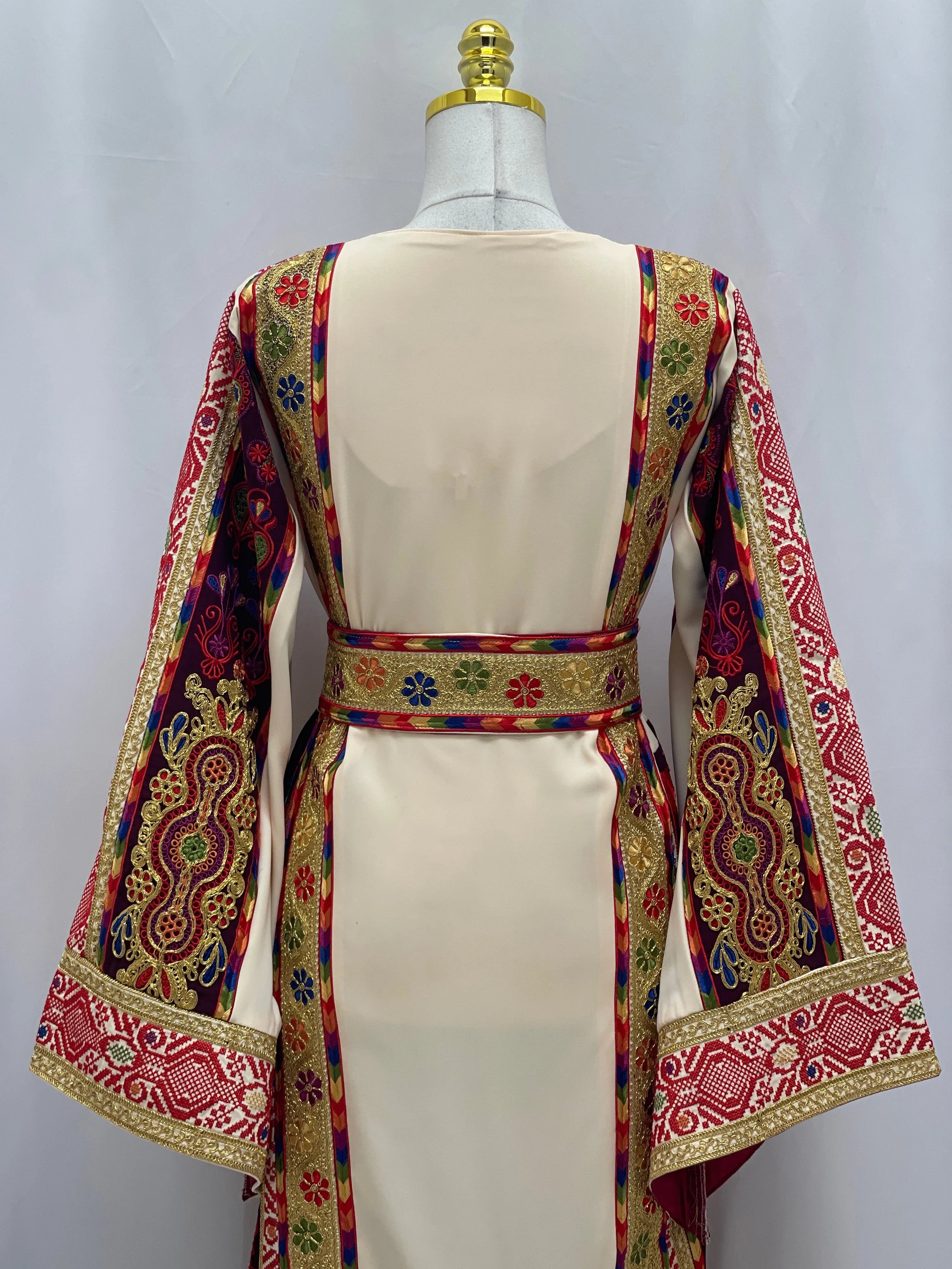 Back view of Al Kananiyyah Embroidered Thobe featuring colorful intricate embroidery and a cinched waist