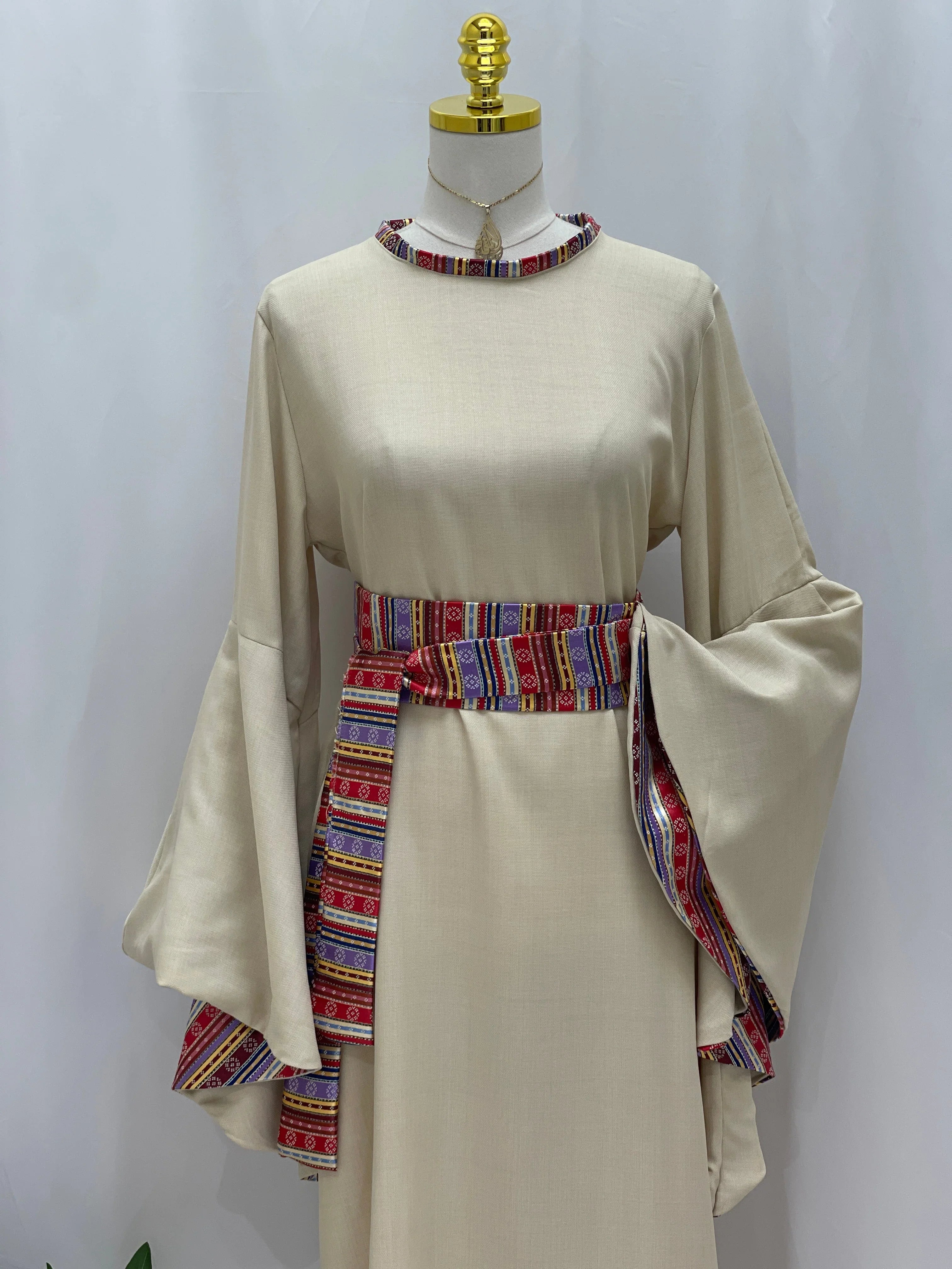 Palestinian Elegance Al-Mais Thobe in beige with embroidered sleeves and belt for a stylish look