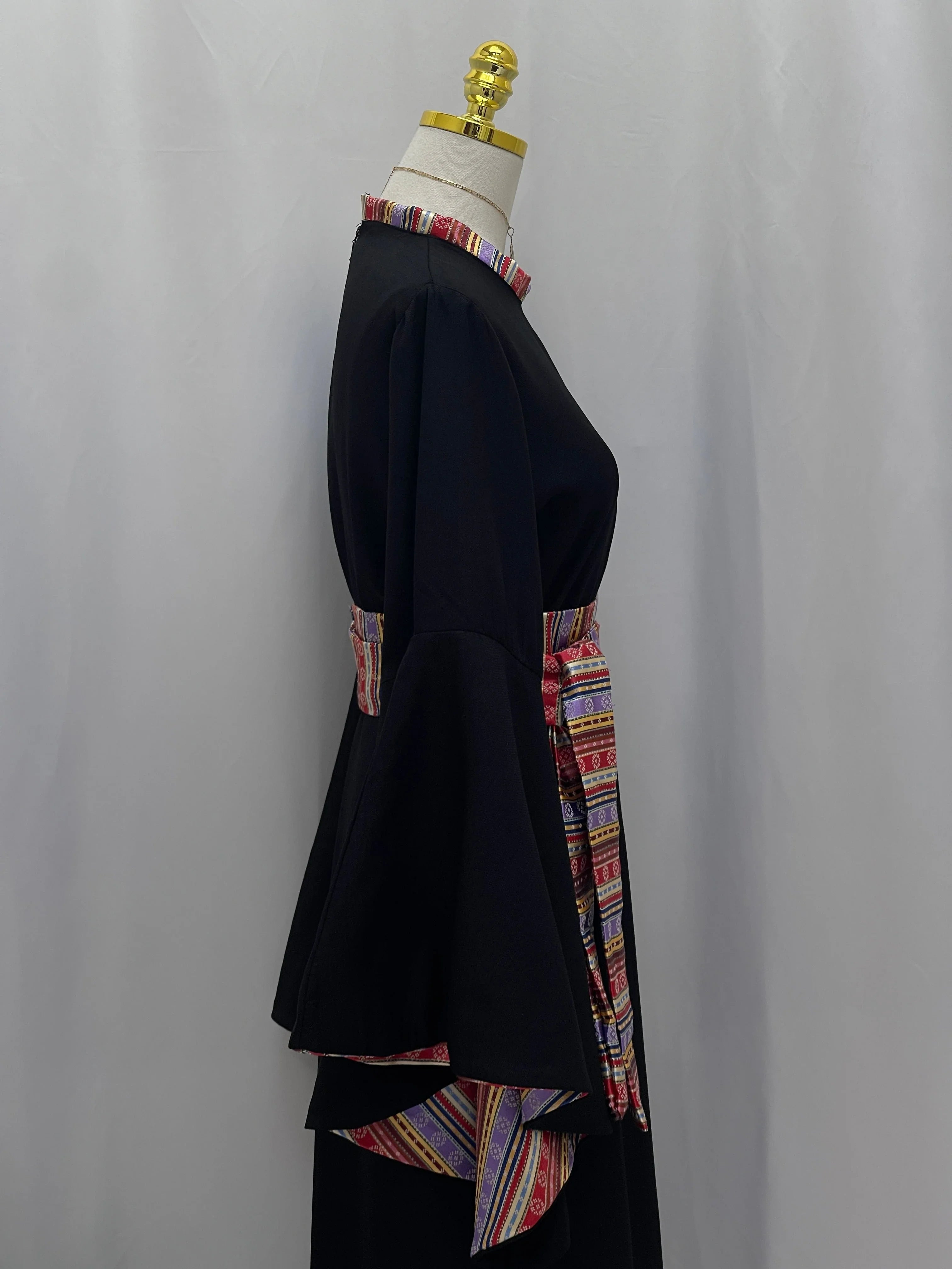 Elegant Al-Mais Thobe in black with colorful embroidered belt and bell sleeves