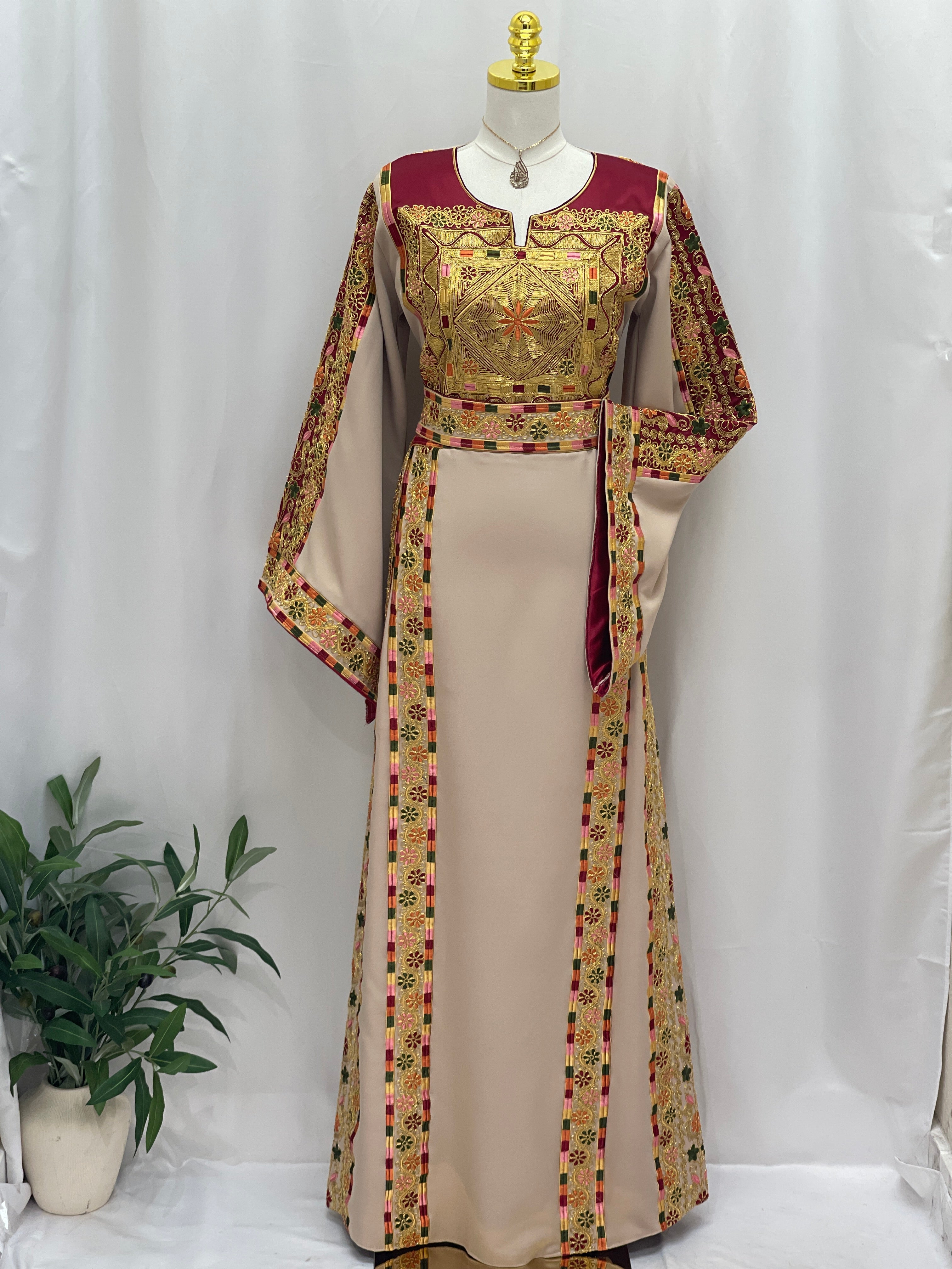 Elegant Al-Qasab Malaki Thobe with intricate embroidery and vibrant colors, perfect for special occasions