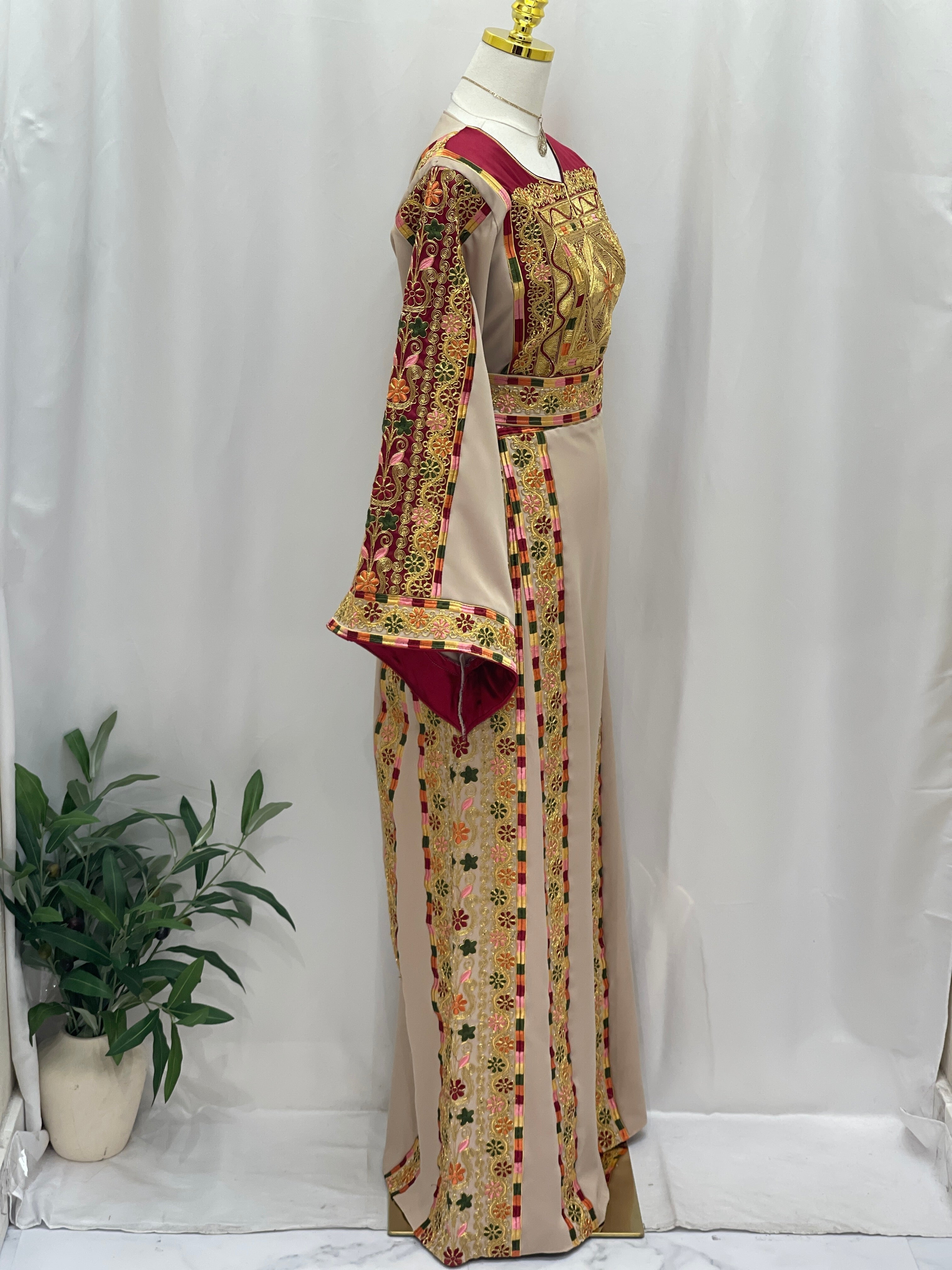 Elegant Al-Qasab Malaki Thobe with intricate embroidery and detailed sleeves, perfect for traditional events.