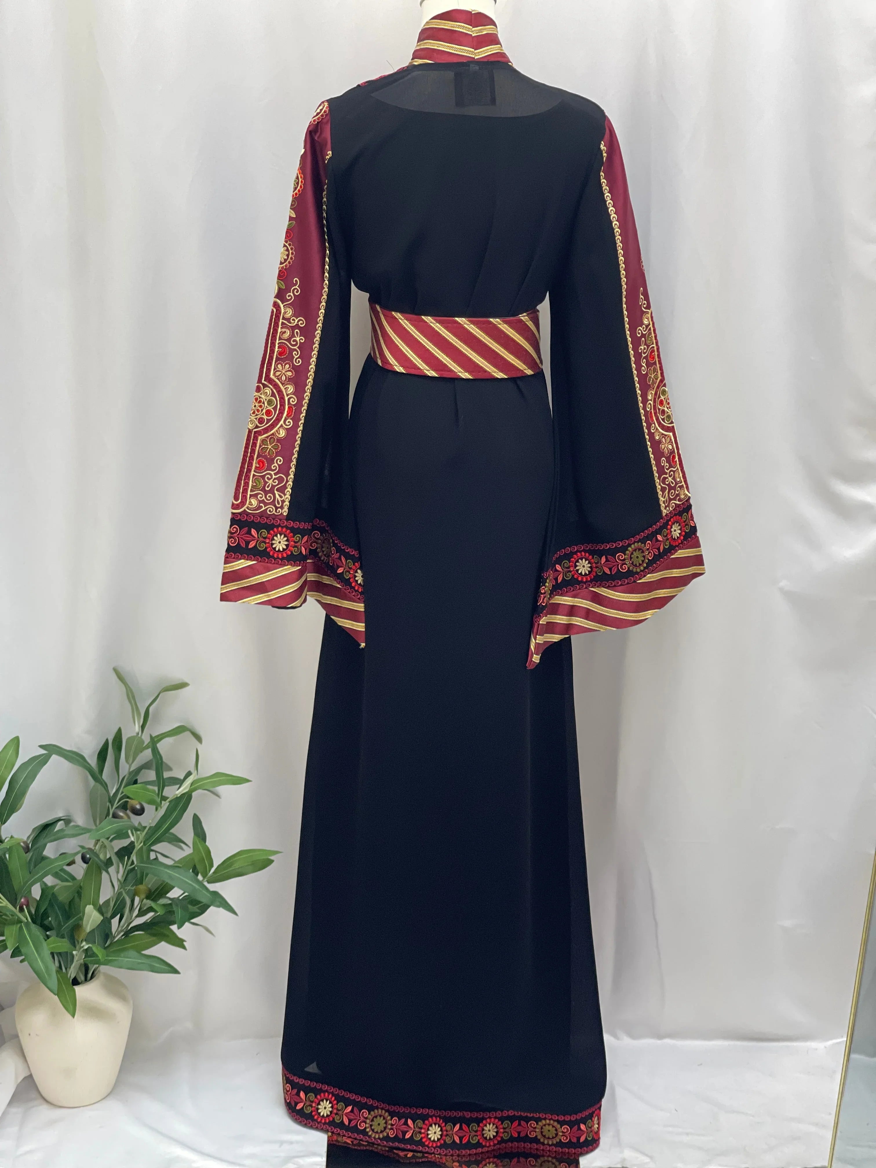 Palestinian Elegance embroidered Kashmir abaya in black with red and gold detailed embroidery on sleeves and hem
