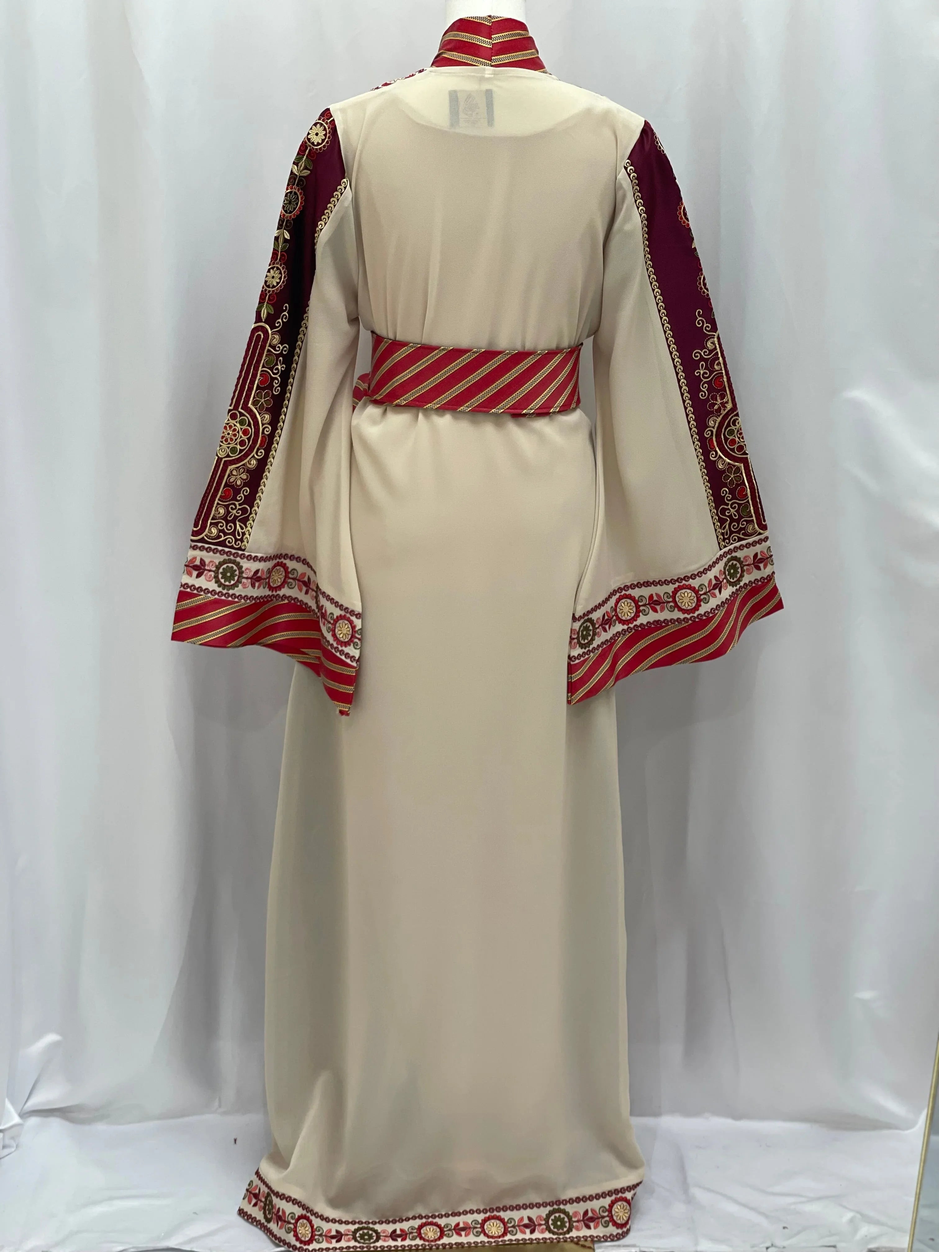 Palestinian Elegance embroidered Kashmir abaya in cream with intricate red and gold sleeve embroidery and matching belt