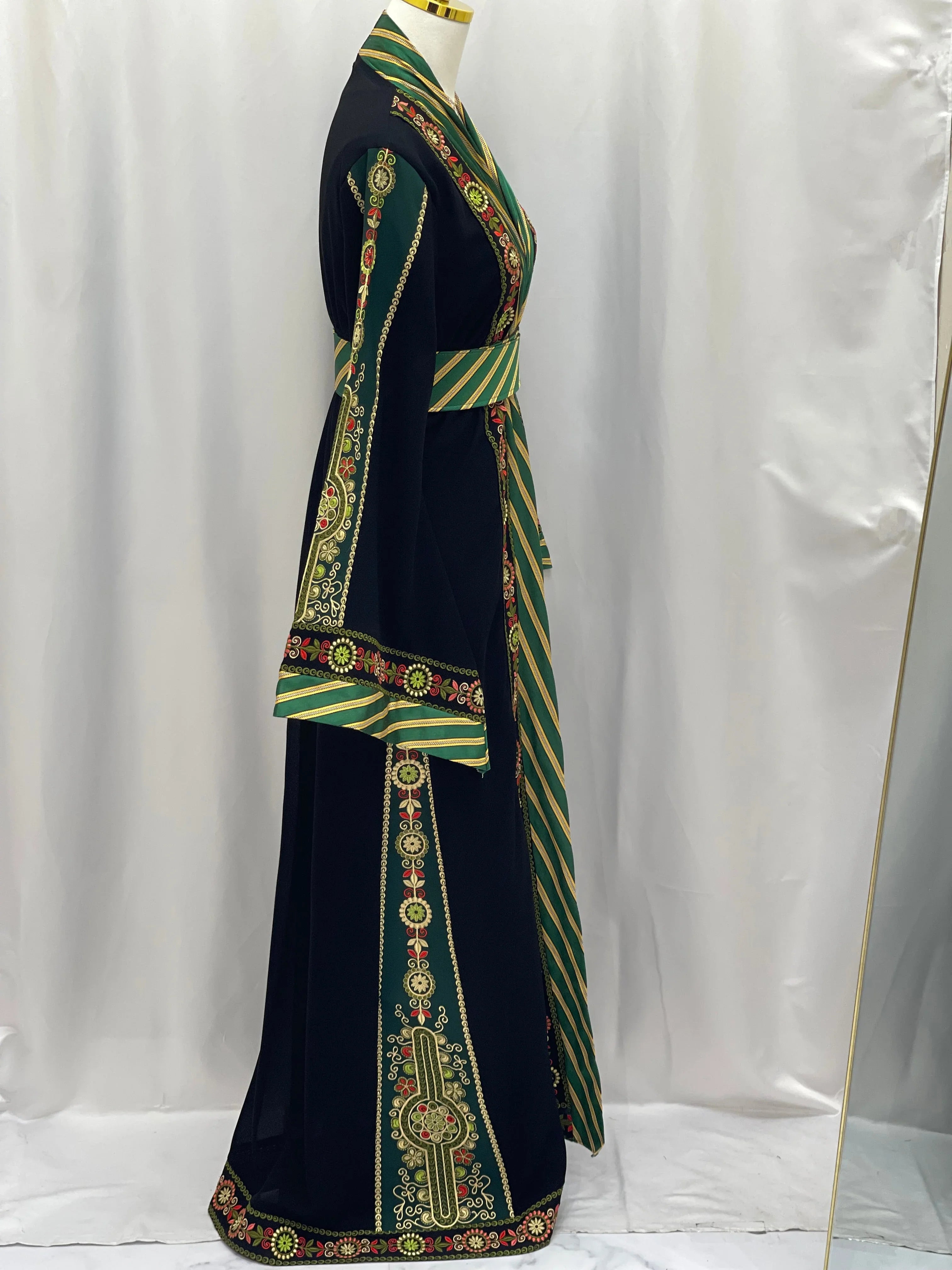 Palestinian Elegance embroidered Kashmir abaya with intricate gold and green embroidery on black fabric