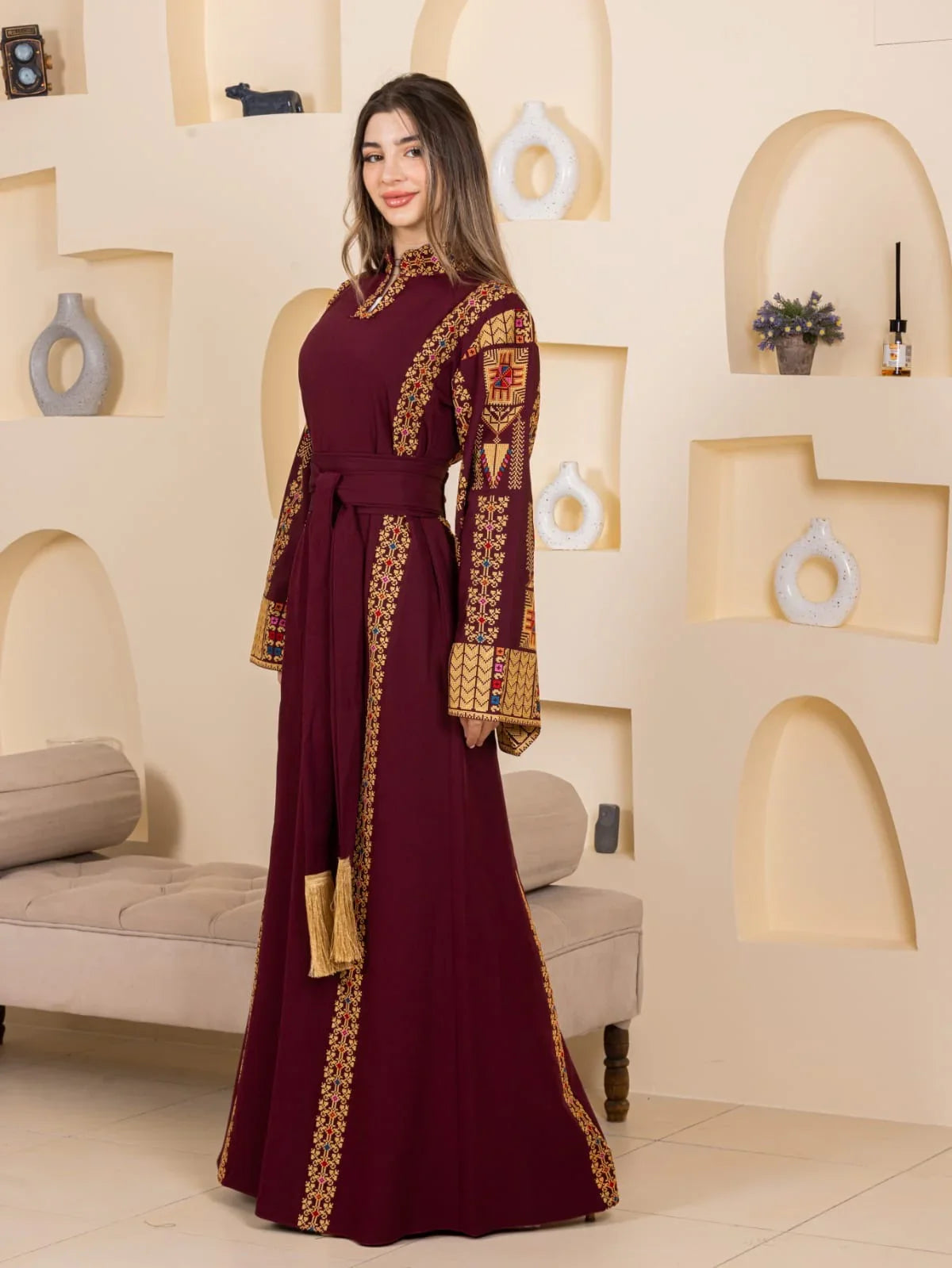 Asala Embroidered Thoub. Palestinian Elegance maroon embroidered thobe with gold Palestinian cross stitch and tie waist