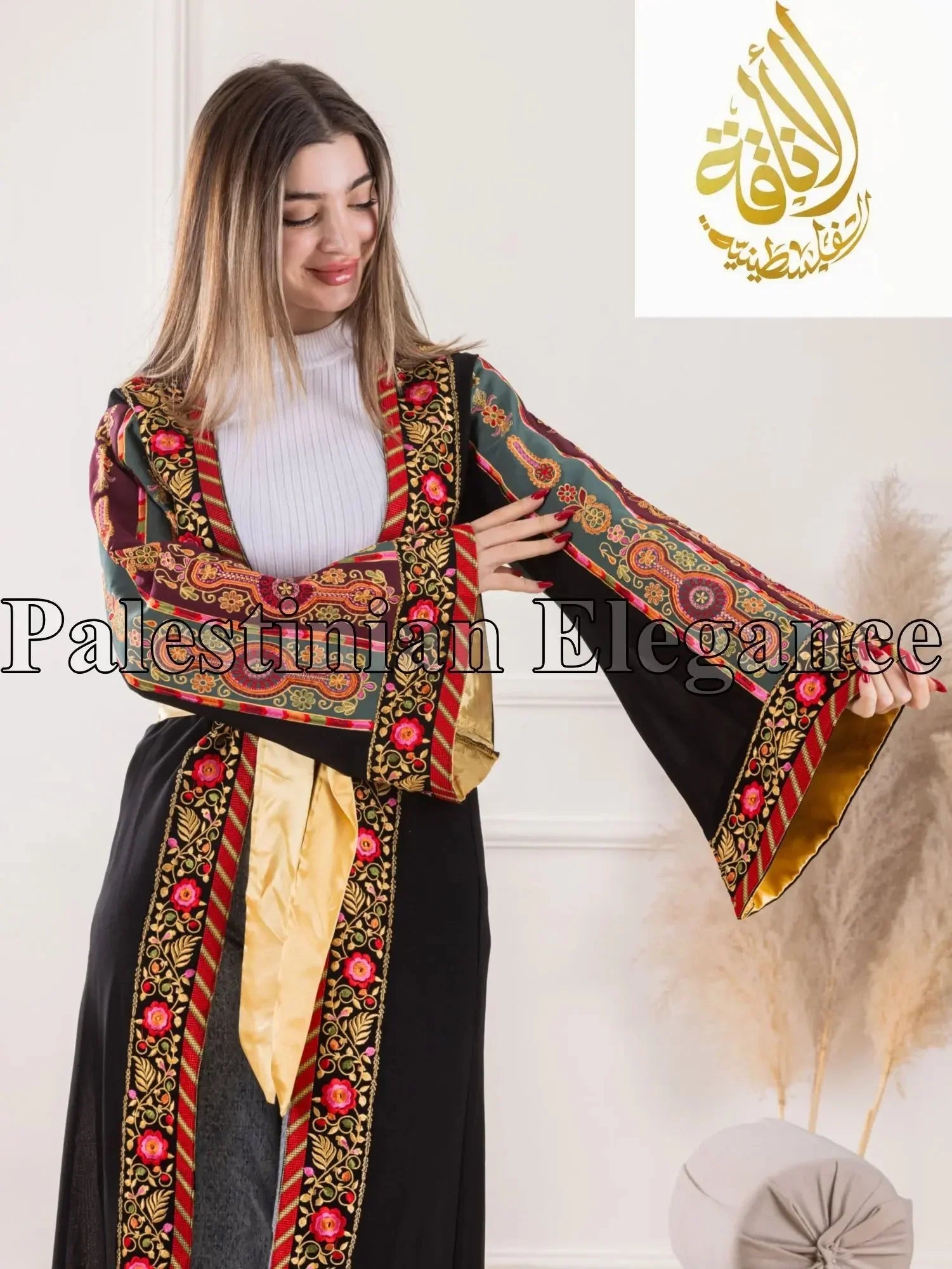 Aseel Malaka embroidered Cardigan by Palestinian Elegance with colorful floral and geometric patterns on black fabric