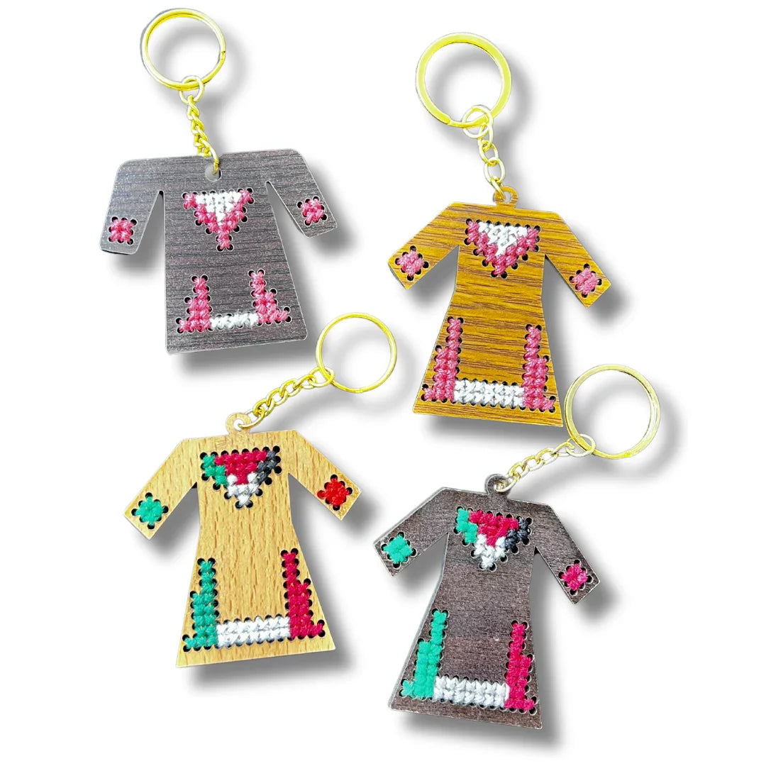 Palestinian Elegance bundle of four Dress Shaped Wood keychains with embroidered cross stitch patterns and gold rings