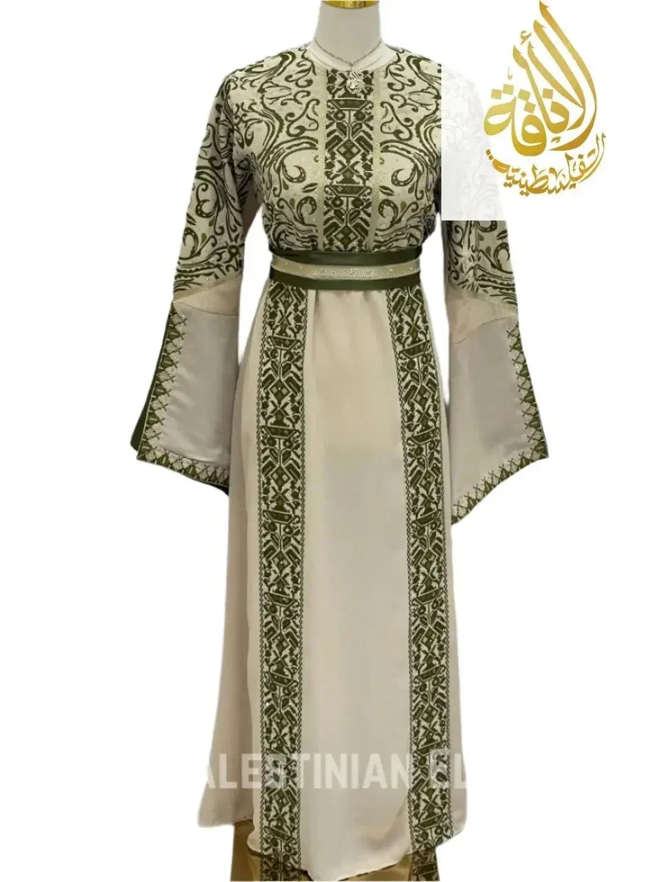 Palestinian embroidered thoub in cream with intricate green embroidery and wide sleeves by Palestinian Elegance