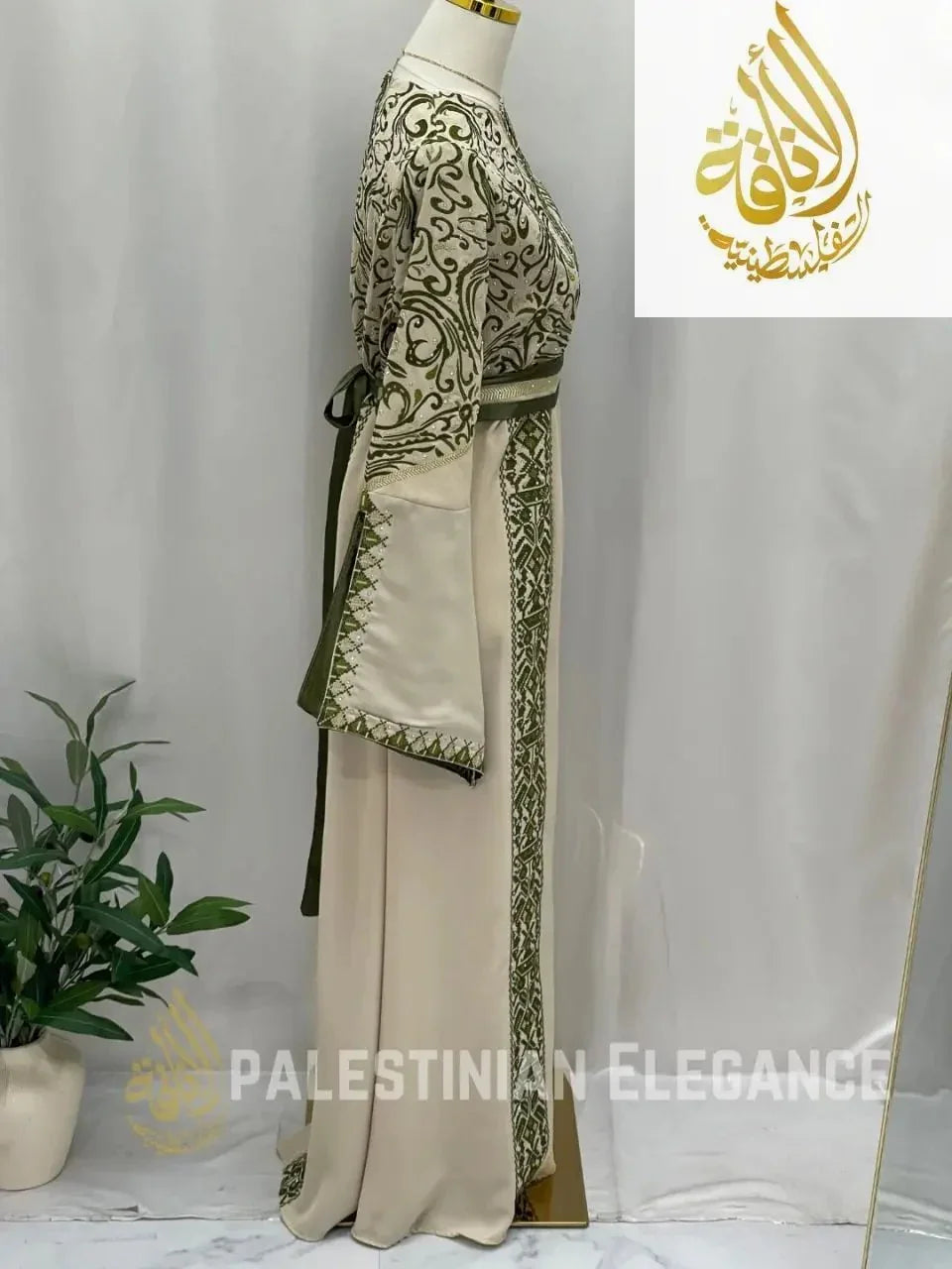 Elegant Palestinian embroidered thoub in beige with green detailed embroidery and long sleeves