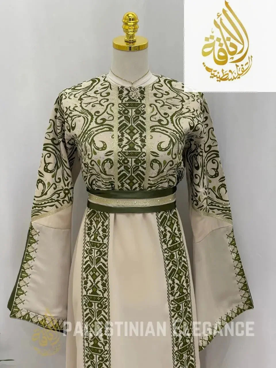 Palestinian embroidered thoub with intricate green embroidery and wide sleeves by Palestinian Elegance