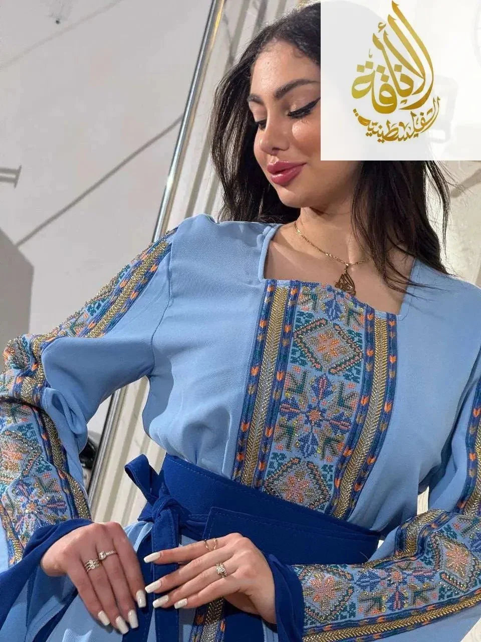 Palestinian Elegance Baby Blue Unique Embroidered Thoub with detailed multicolor embroidery and blue waist tie
