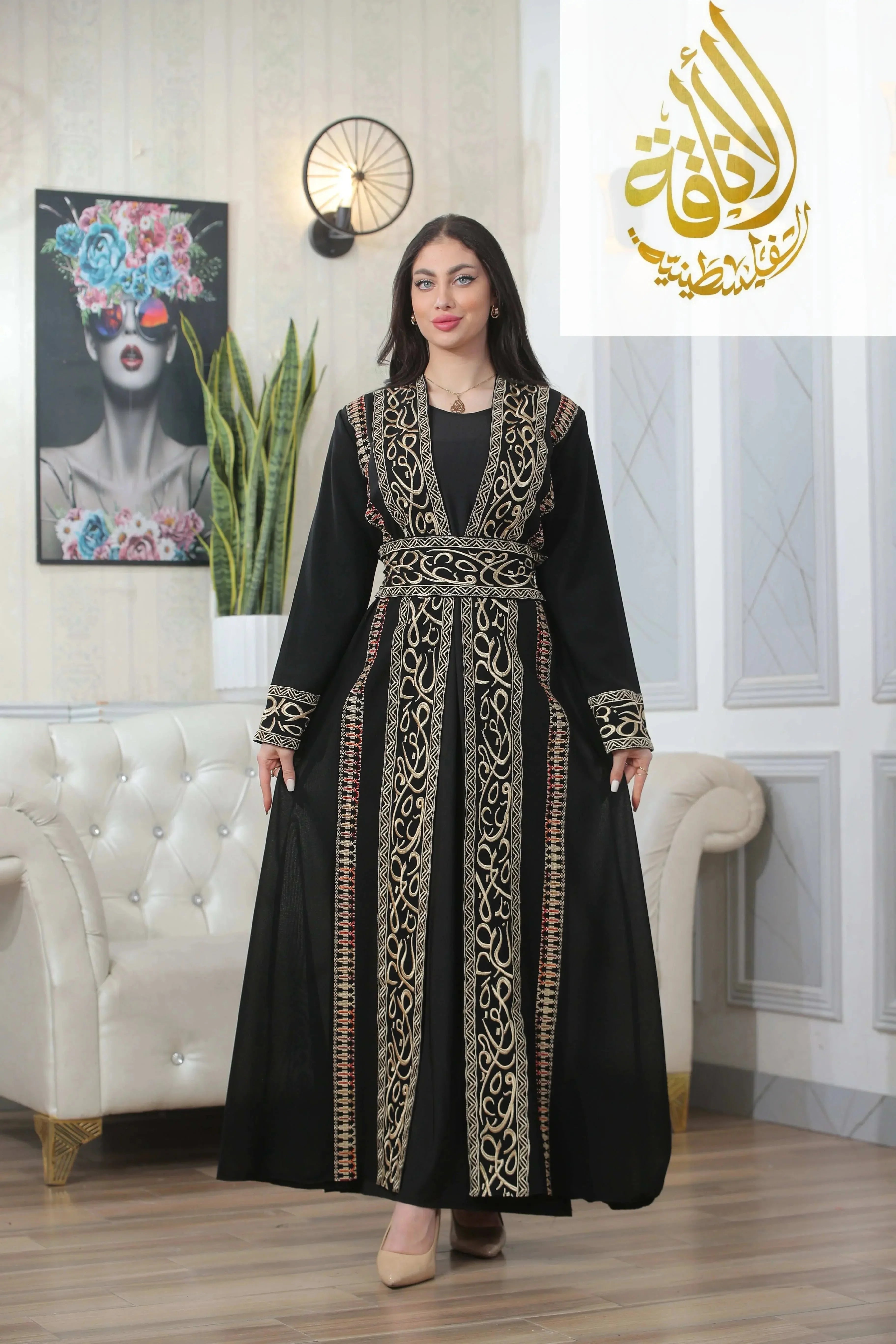 Black thoub with Basma Arabic letters with heritage embroidery Bisht by Palestinian Elegance worn by woman